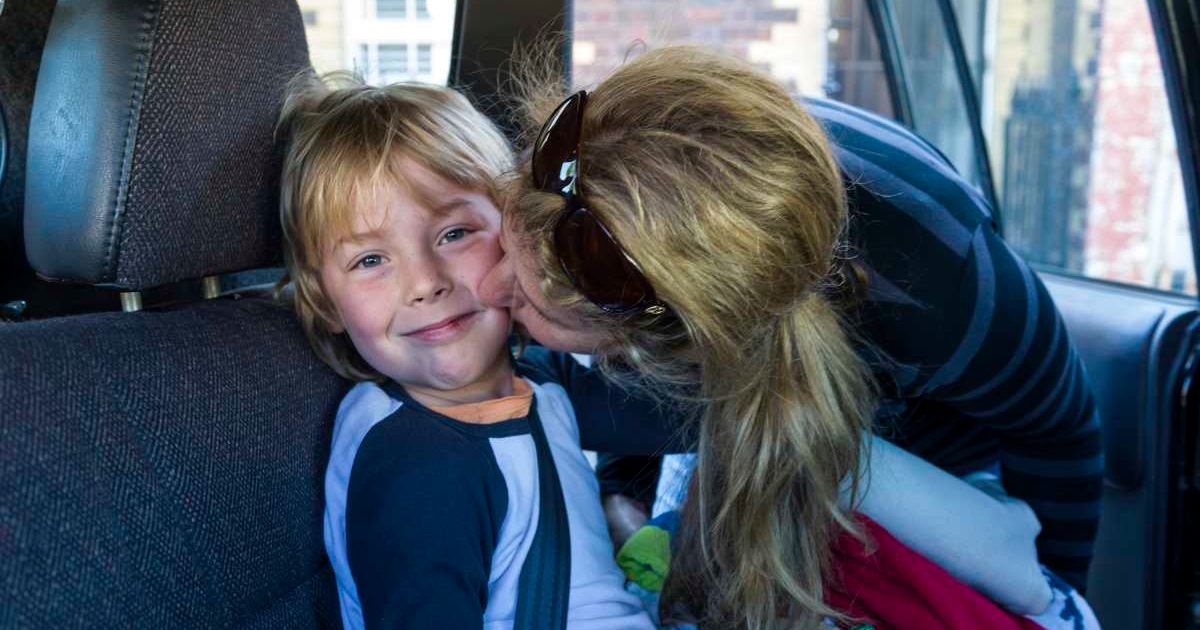 A mother kisses her son in car (Representative Cover Image Source: Getty | stock)