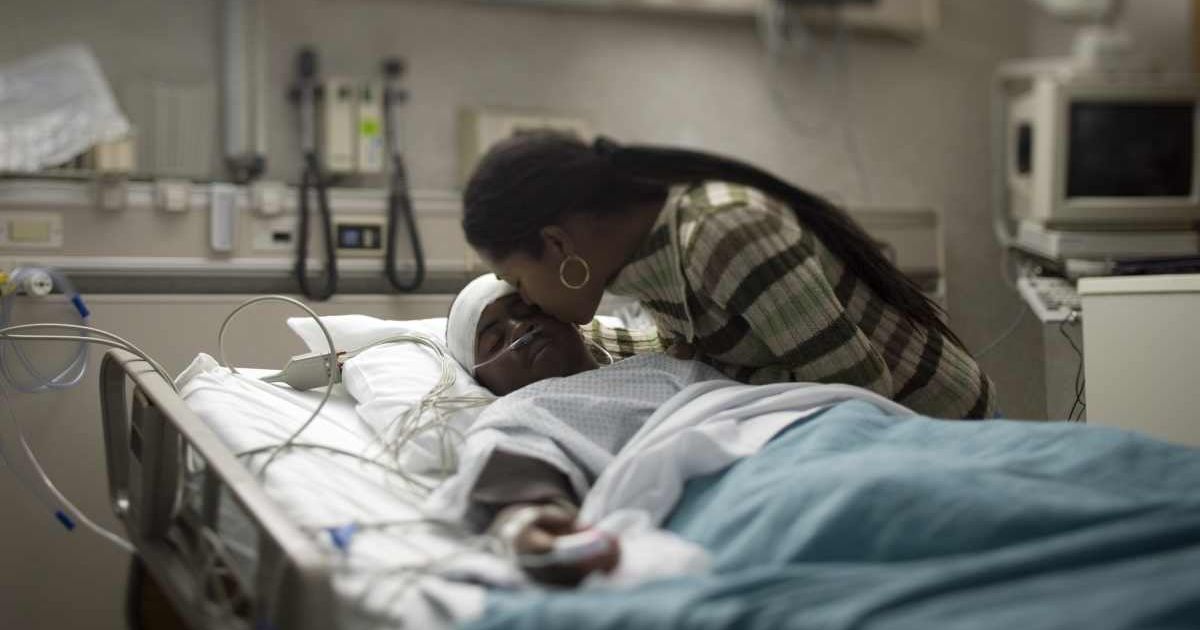 Mom kissing her child on life support. Representative Cover Image Source: Getty Images | Rubberball