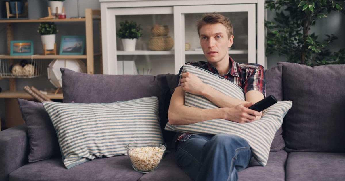 Man watching TV with a surprised expression. Representative Cover Image Source: Pexels | Vitaly Gariev