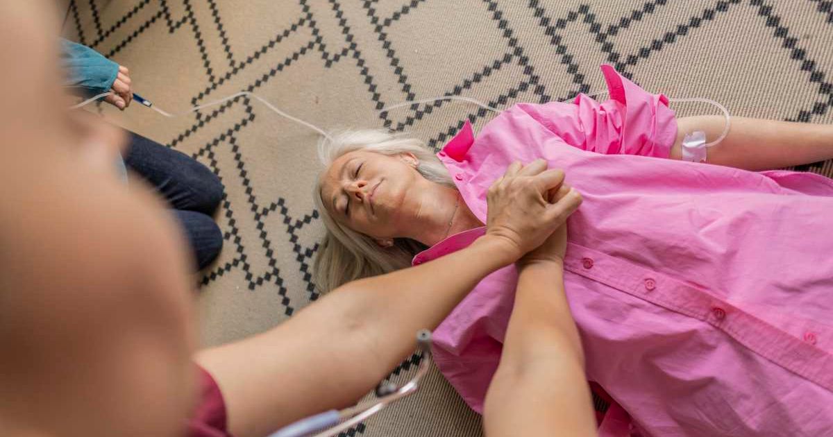A first responder checking on an old woman. Representative Cover Image Source: Getty Images | Jose Carlos Serdeno