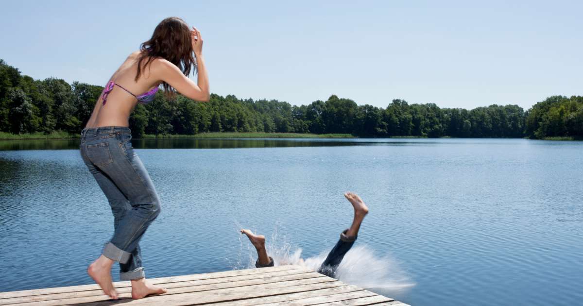 A woman is trying to jump into the water to save a drowning man. (Representative Cover Image Source: Getty | Carl Smith)