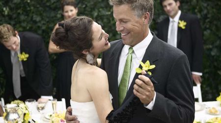 Bride stopped ‘father-daughter’ dance at wedding and invited her sisters to join — what followed moved her dad to tears
