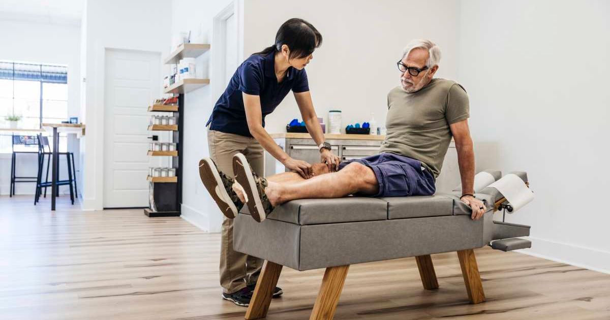 Doctor checking on a man's leg. Representative Cover Image Source: Getty Images | The Good Brigade