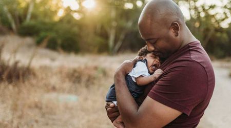 College student found a baby covered in ants in trash can while on vacation—what he did next stunned all