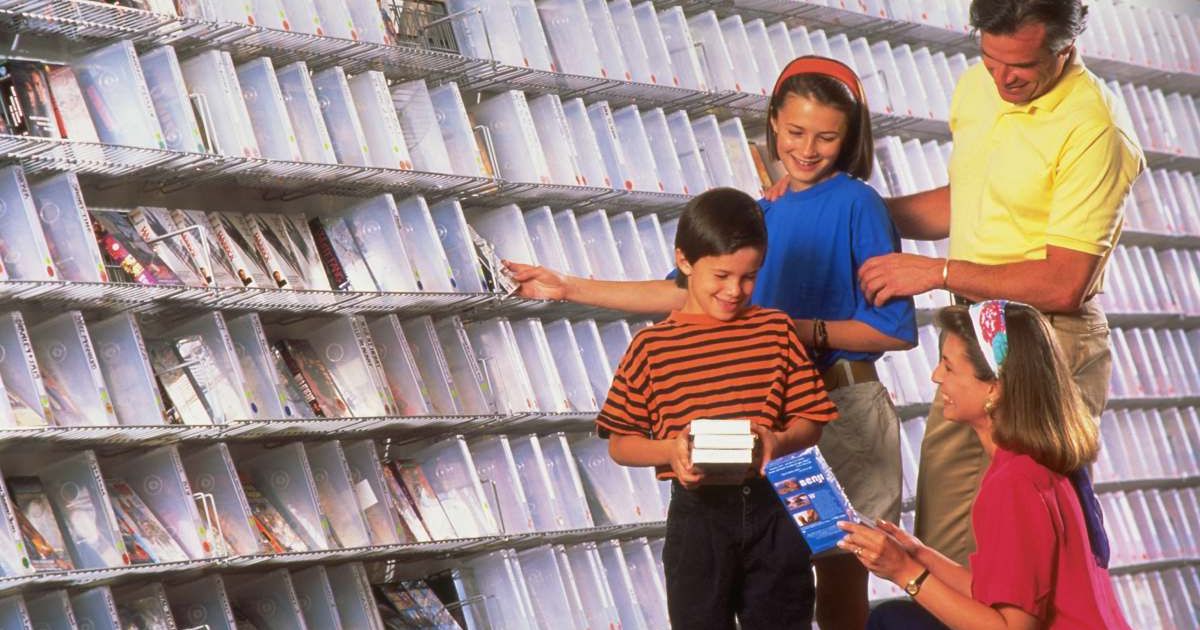 Family buying VHS Tapes at a video store. Representative Cover Image Source: Getty Images | Chuck Savage