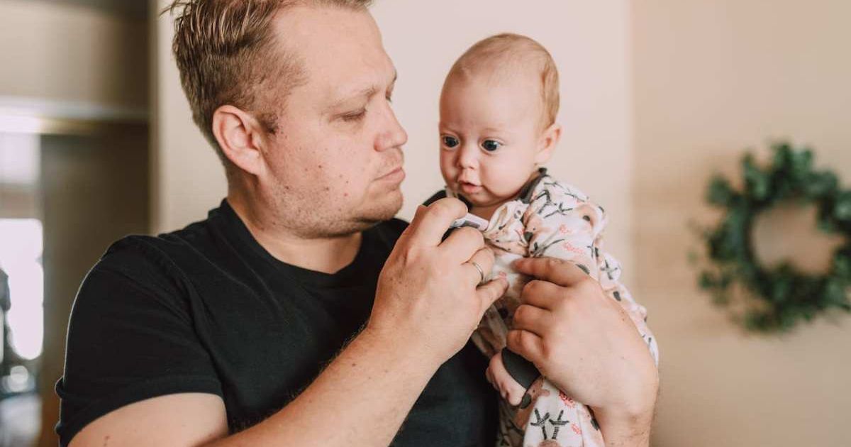 Dad holding baby close to himself. Representative Cover Image Source: Pexels | RDNE Stock project