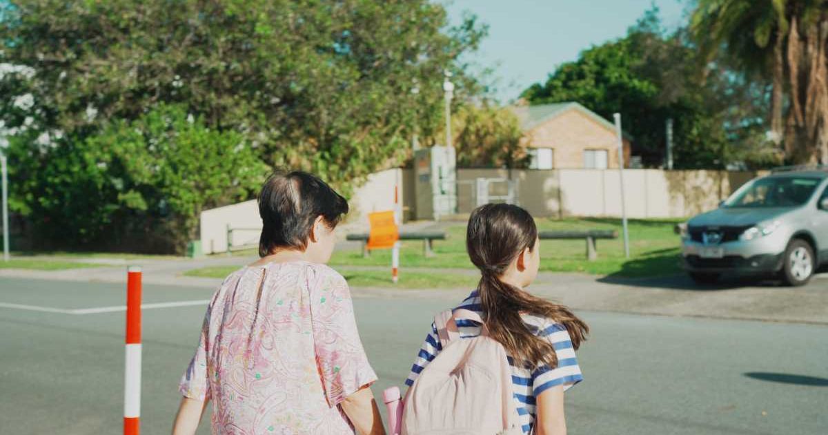 Grandma and granddaughter walking across the road. Representative Cover Image Source: Getty Images | Blessed Selections