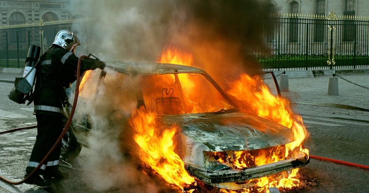 Firefighter trying to extinguish a car on fire. Representative Cover Image Source: Pexels | David Henry