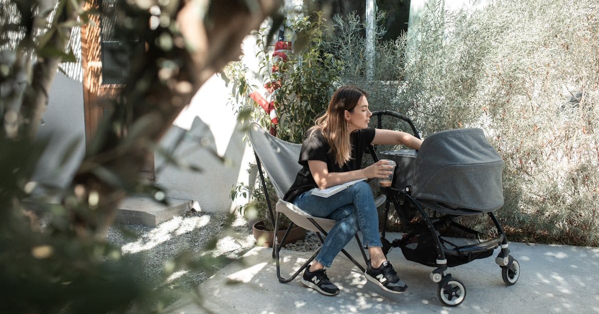 Woman with a baby stroller. Representative Cover Image Source: Pexels | RDNE Stock project