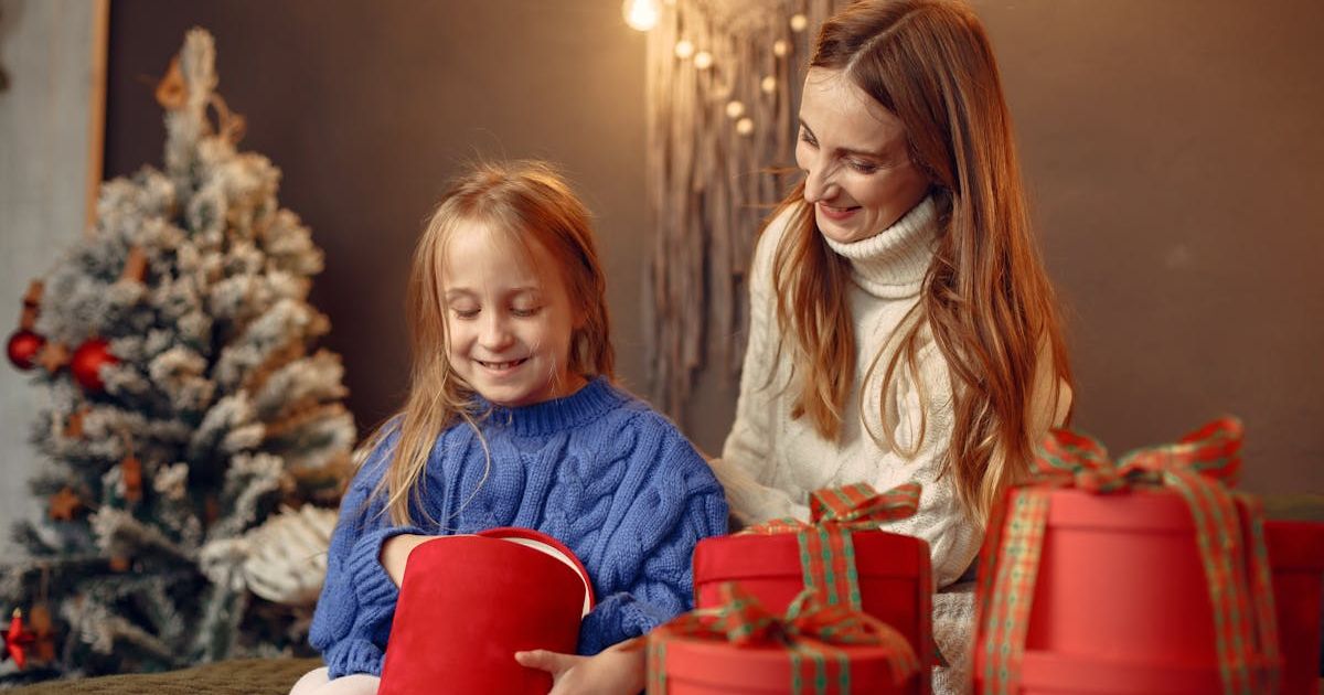 Mom and daughter opening Christmas gifts. Representative Cover Image Source: Pexels | Gustavo Fring