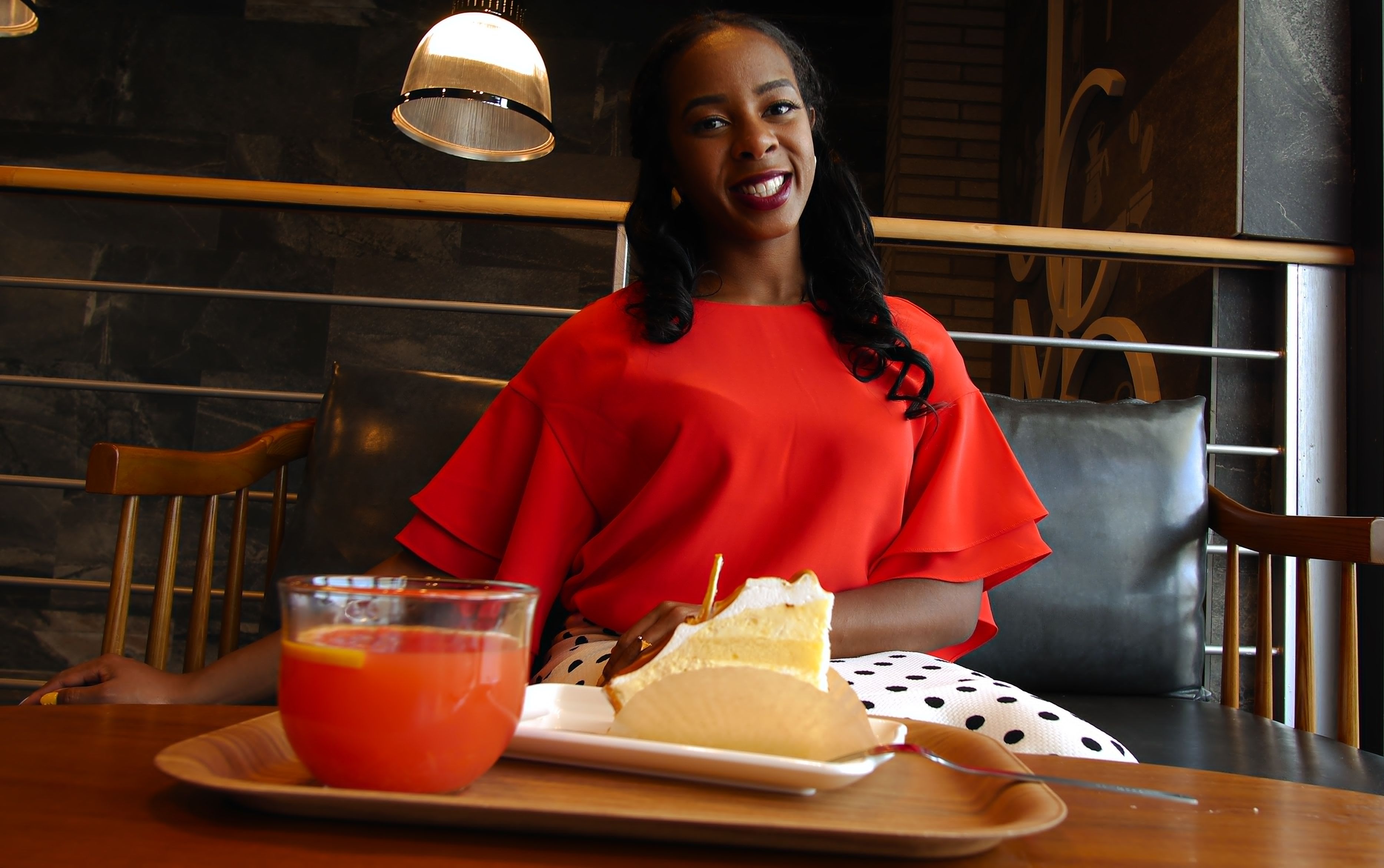 A woman is having a meal at a restaurant.