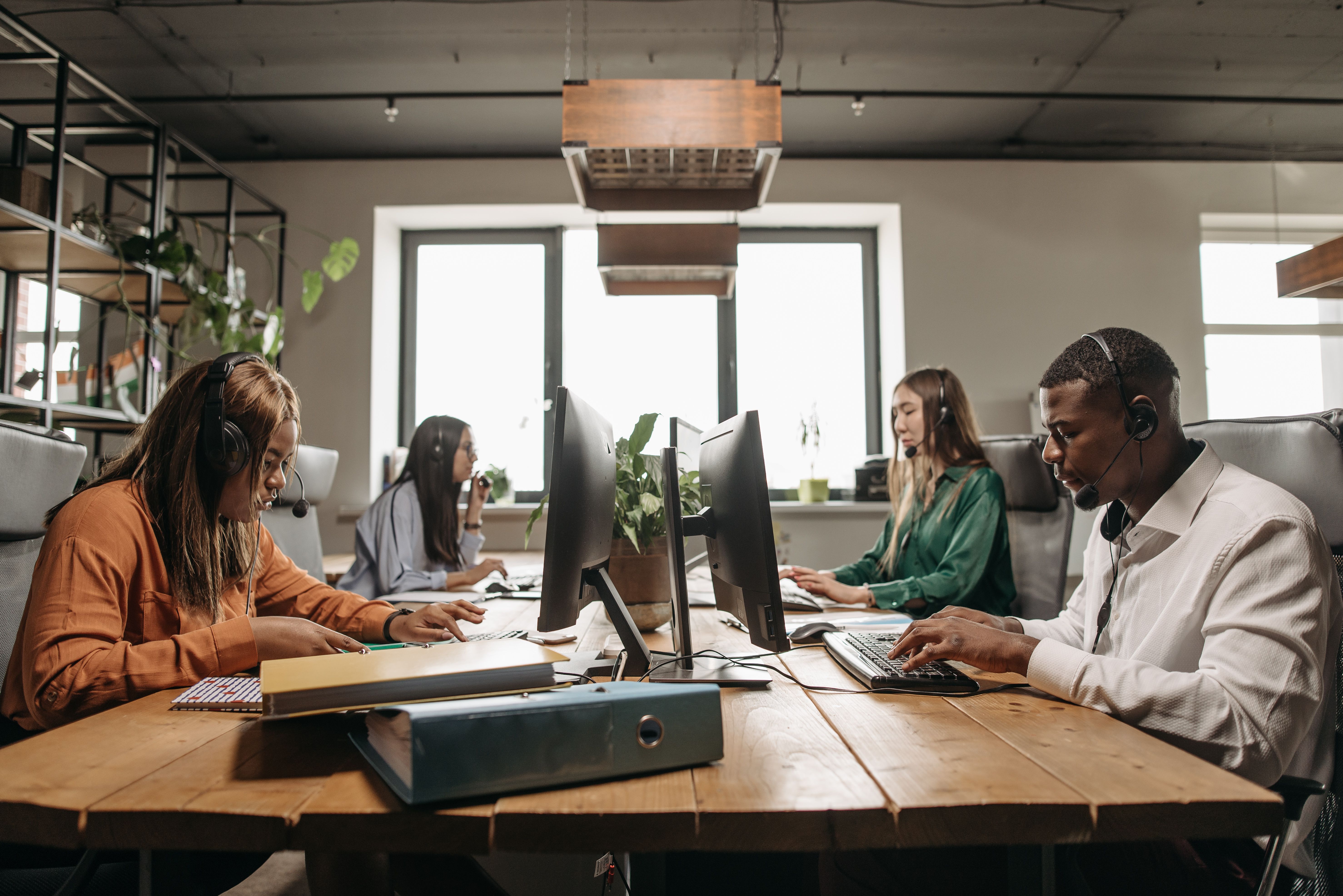 Employees are using a shared office to work.