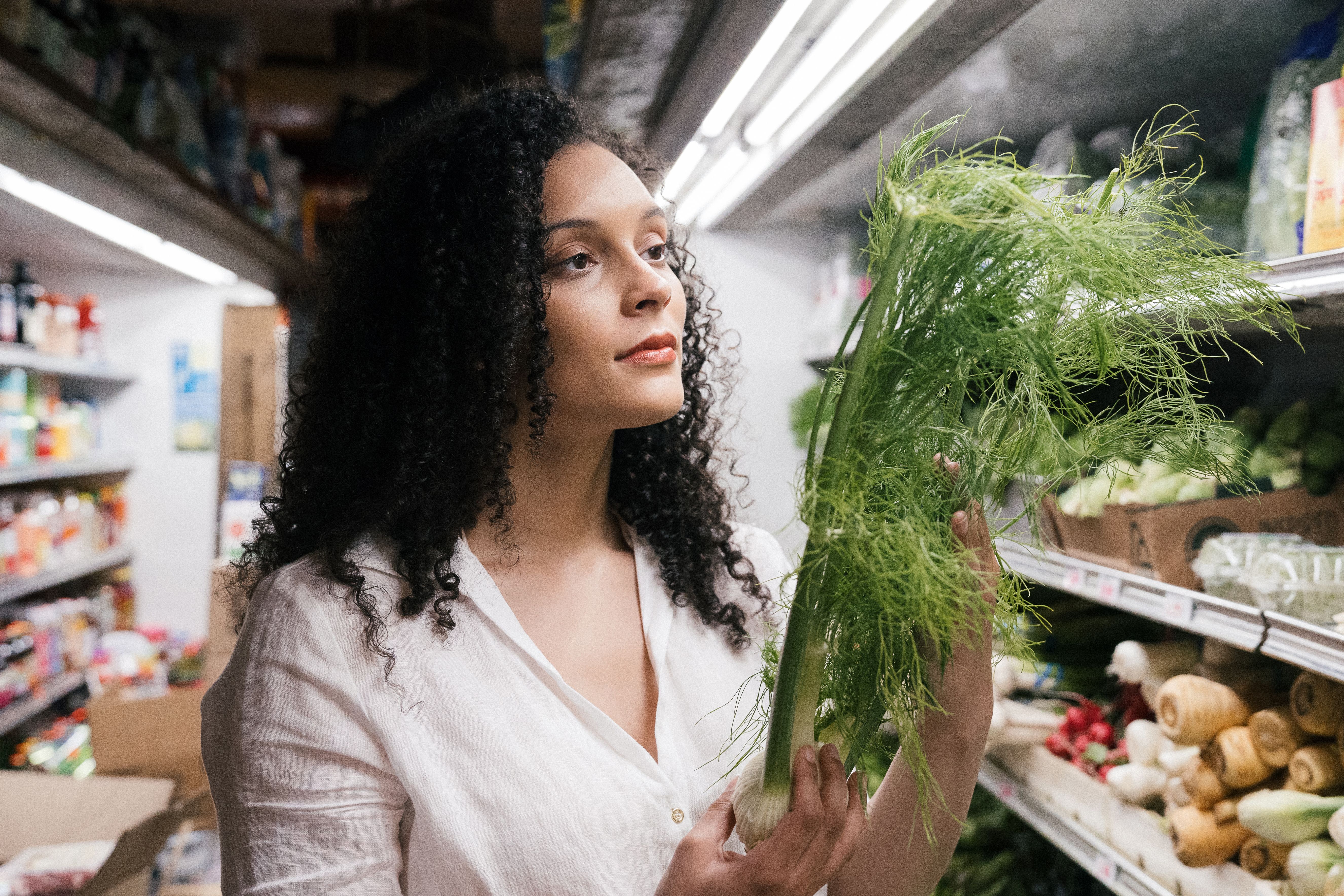 A woman is grocery shopping.