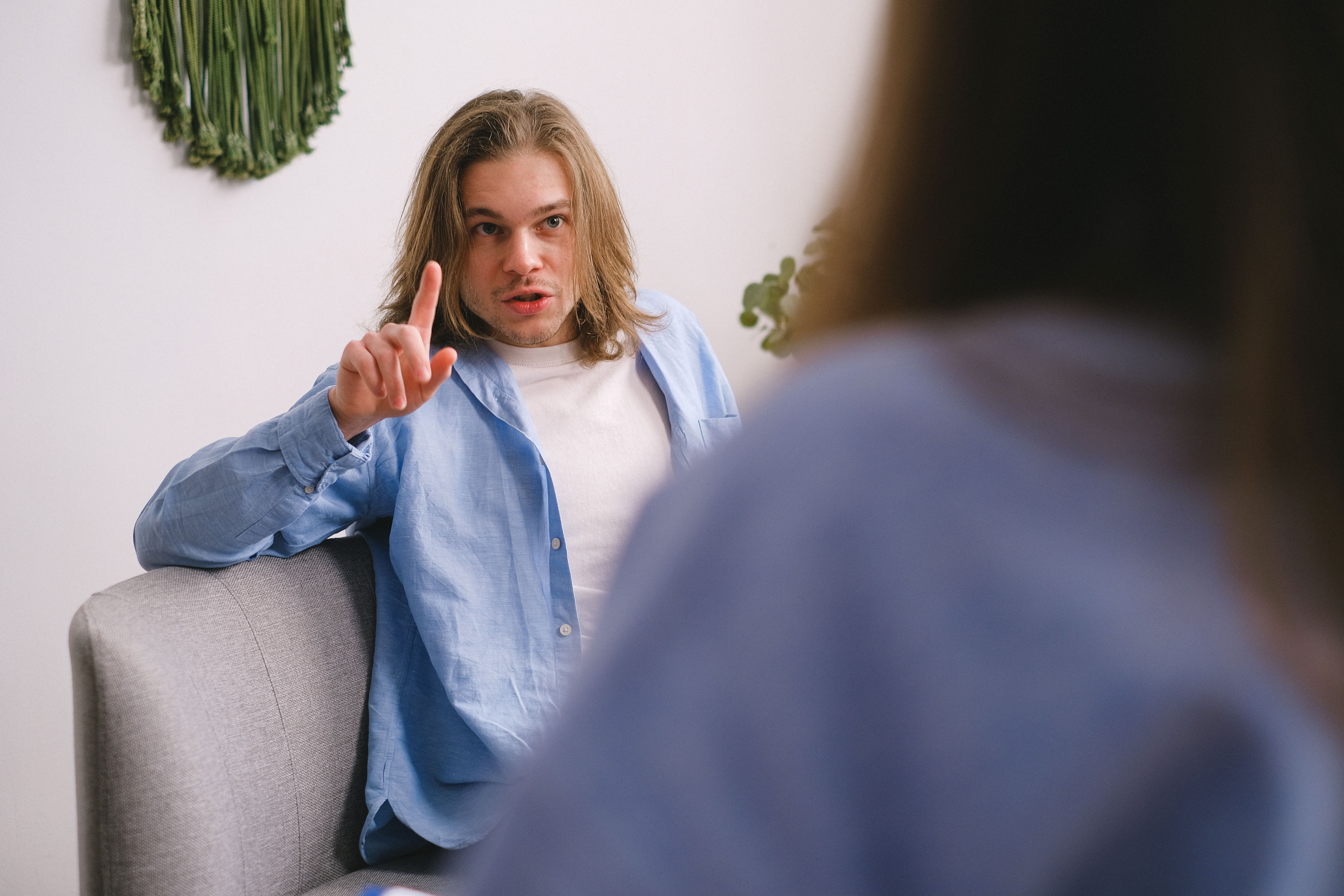 A man arguing and trying to make a point.