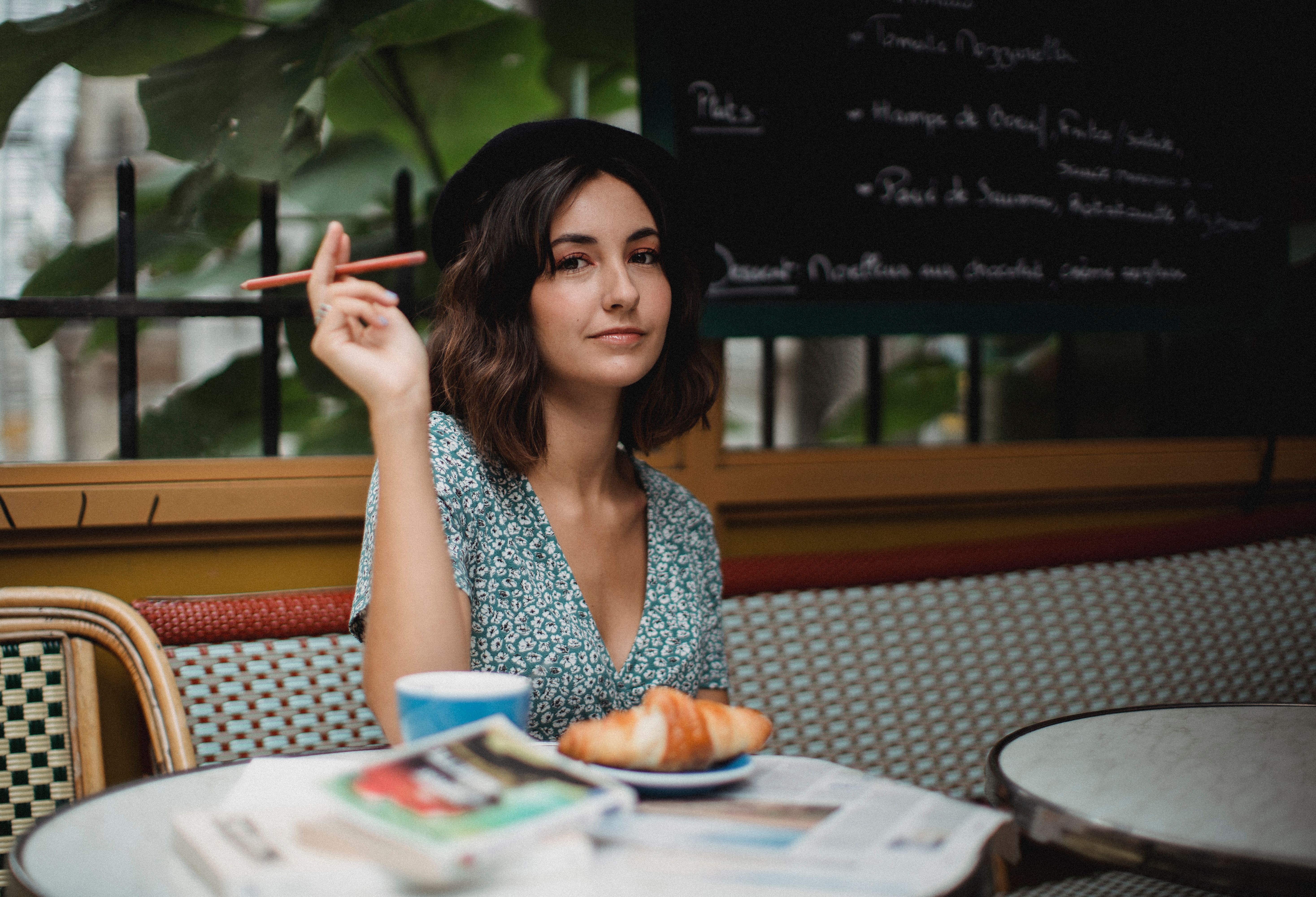 A woman is enjoying a solo meal.