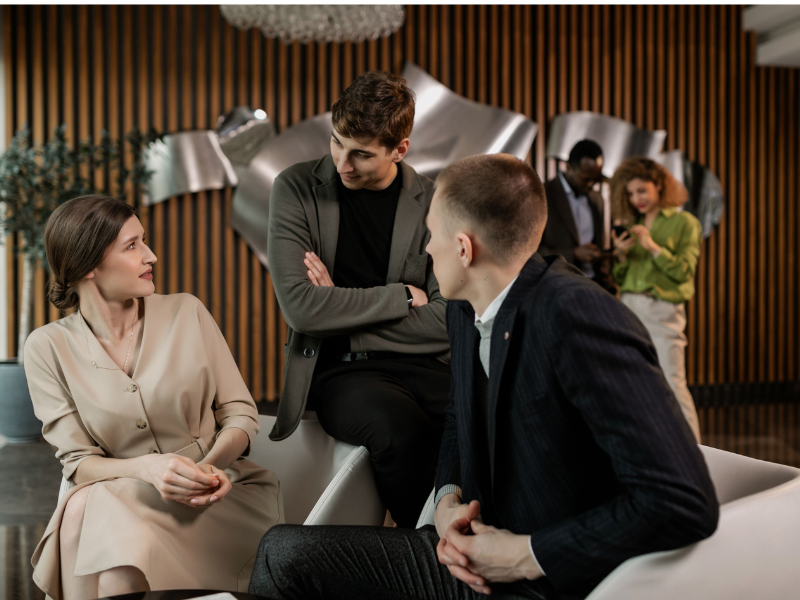 Woman talking to a man at a gathering.