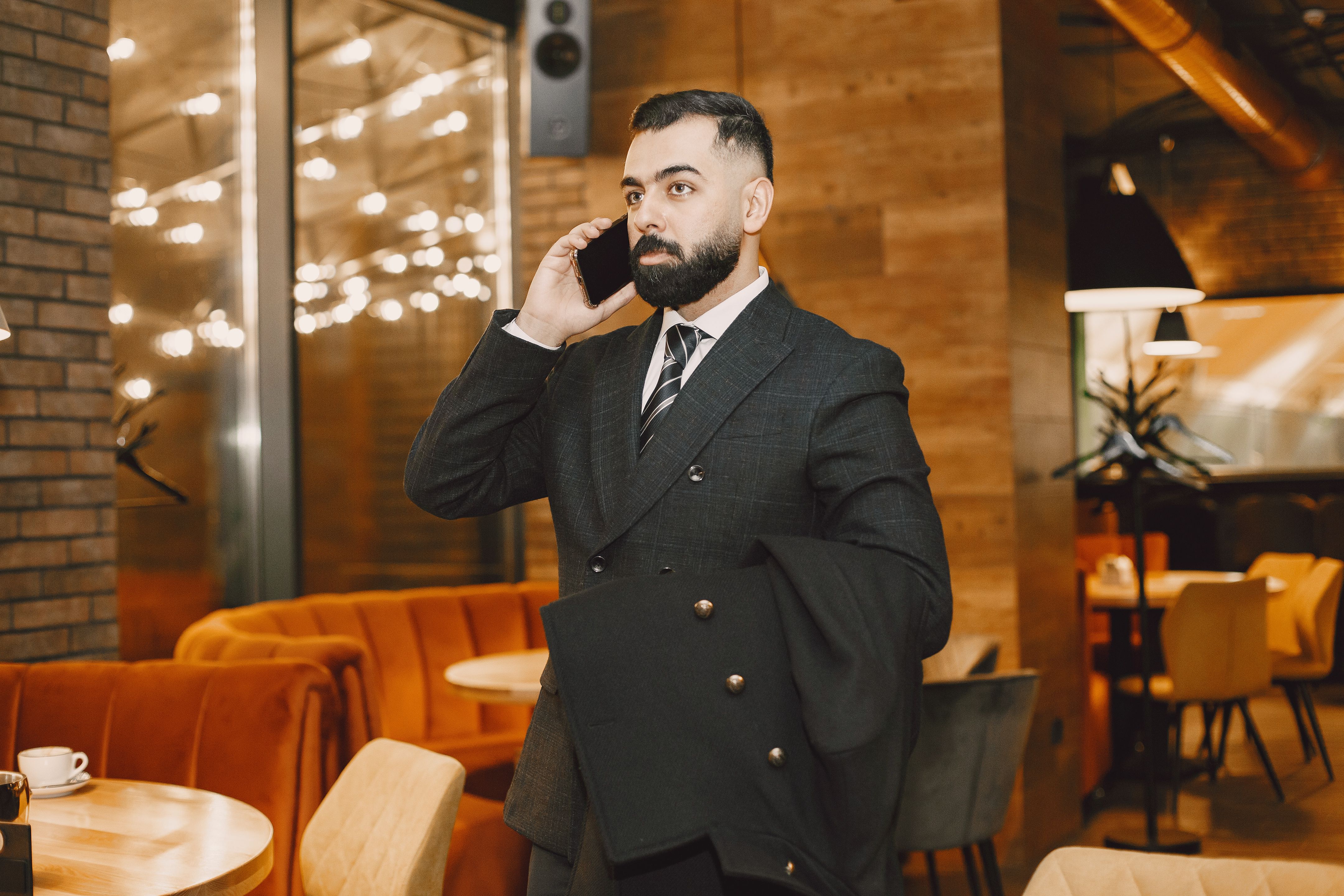 A rich businessman is at a cafe.