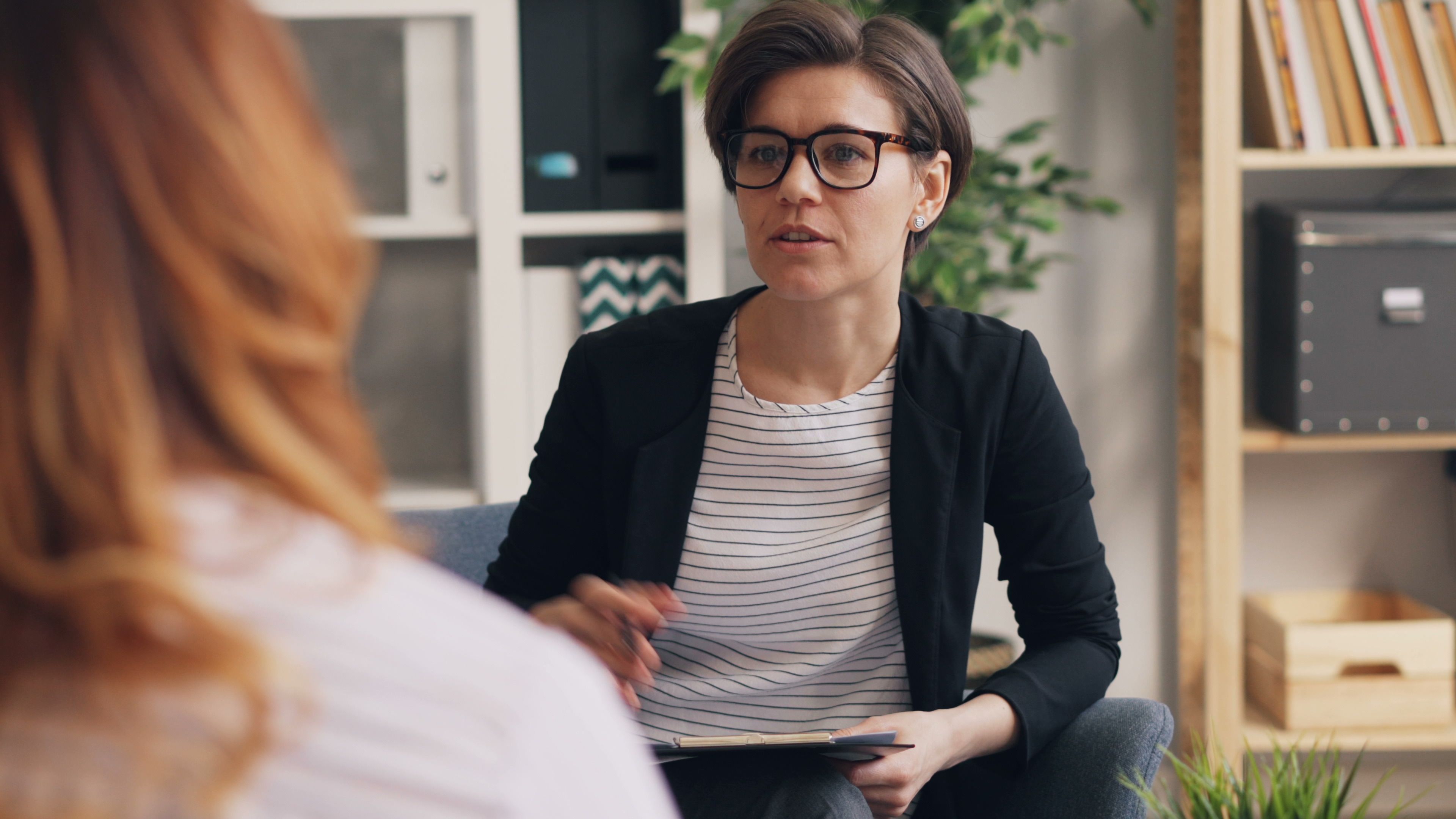 A woman is engrossed in a serious conversation.