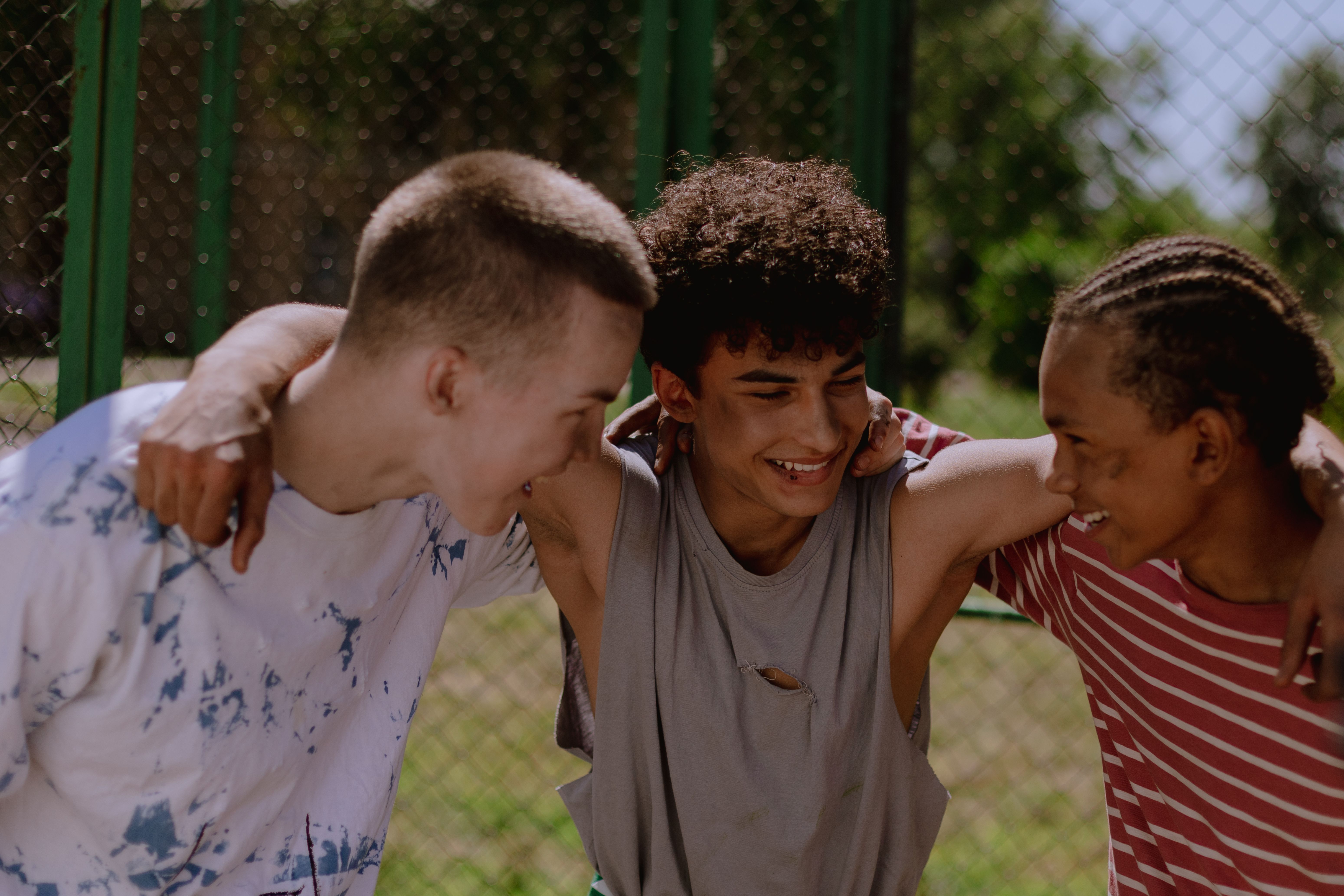 A group of teenagers laughing.