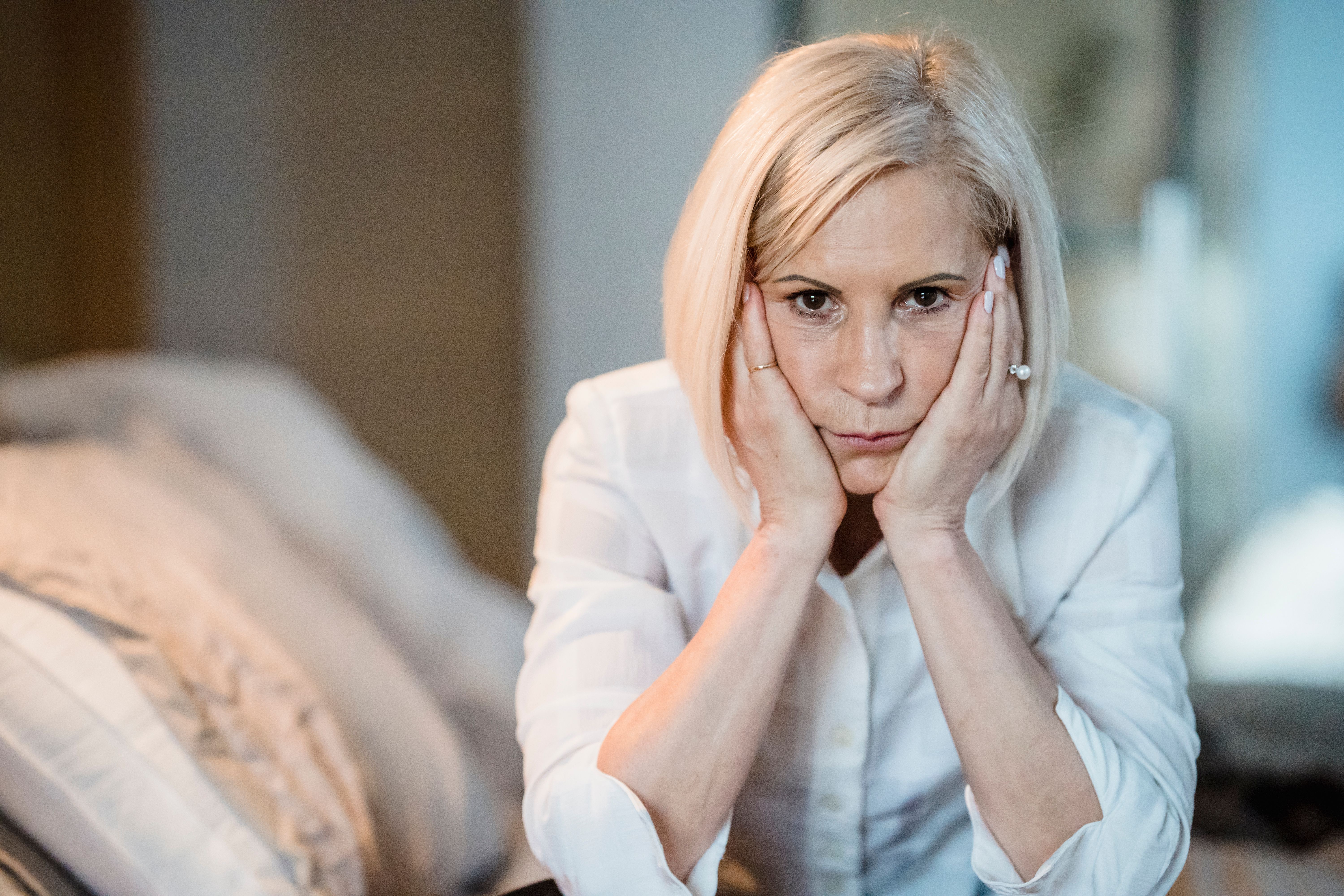 A woman looks displeased and annoyed.