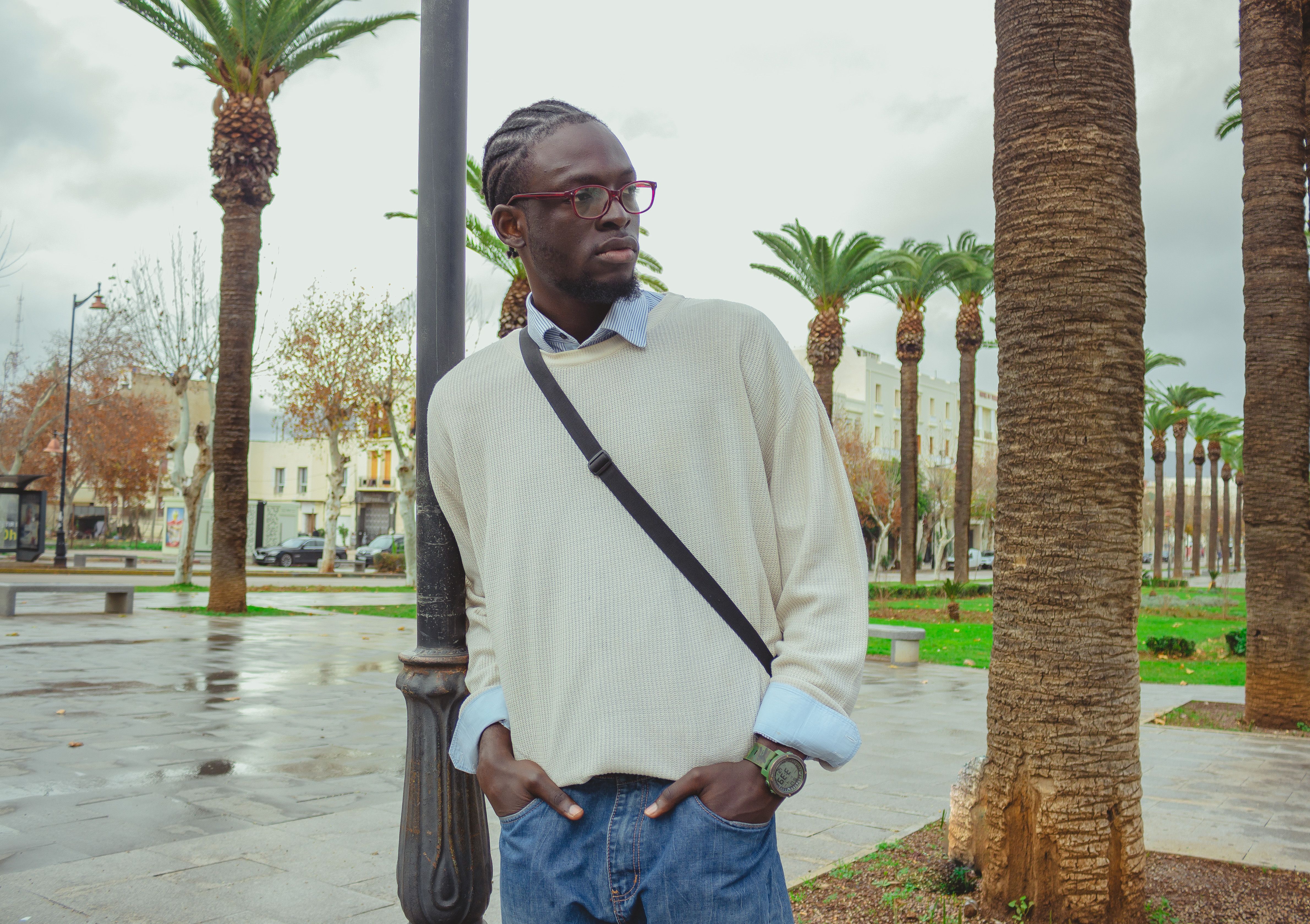 A tall man looking at someone.