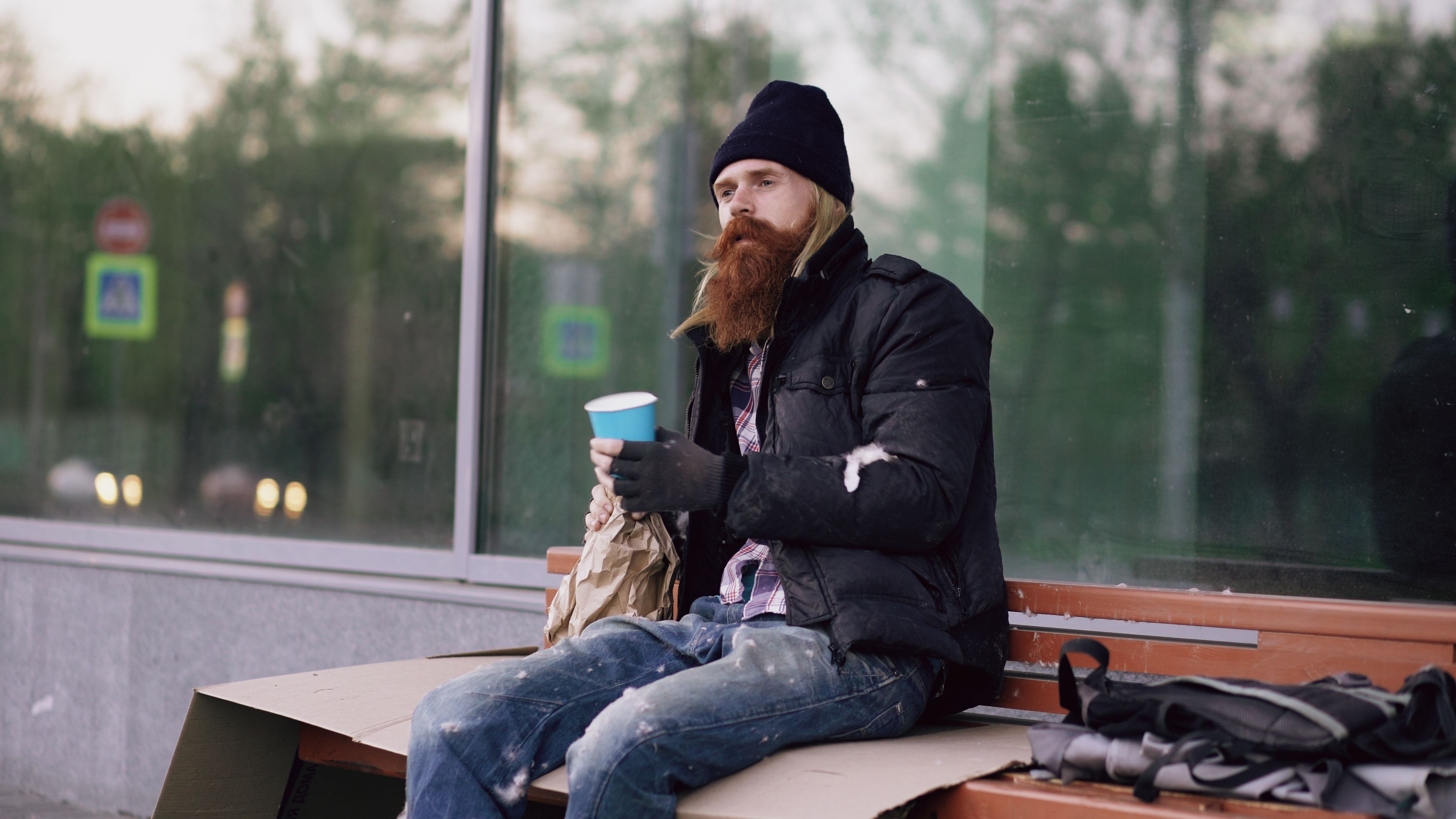 A homeless man looks suspiciously.