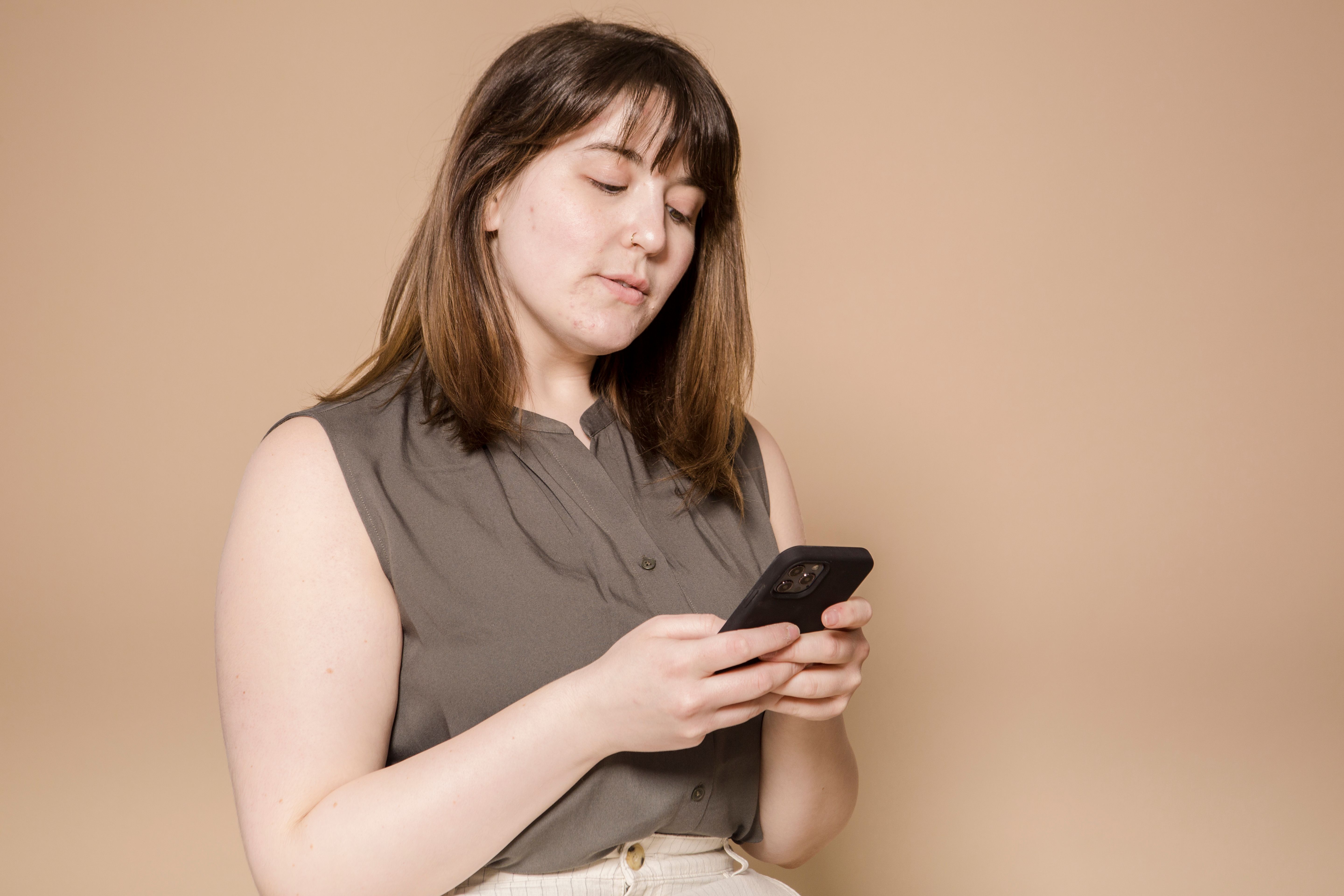 A woman texting on her phone.