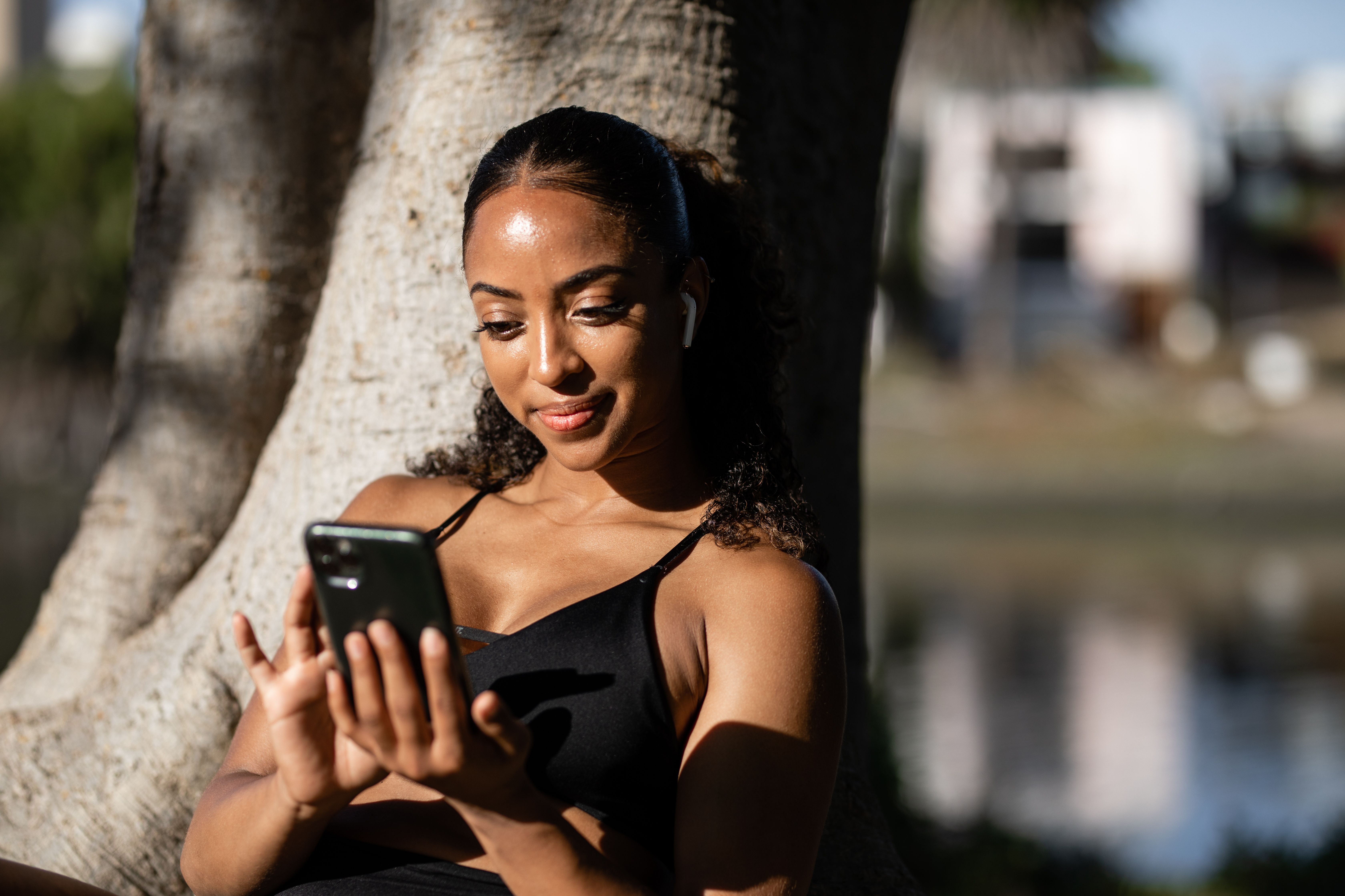 A woman is texting on her phone.