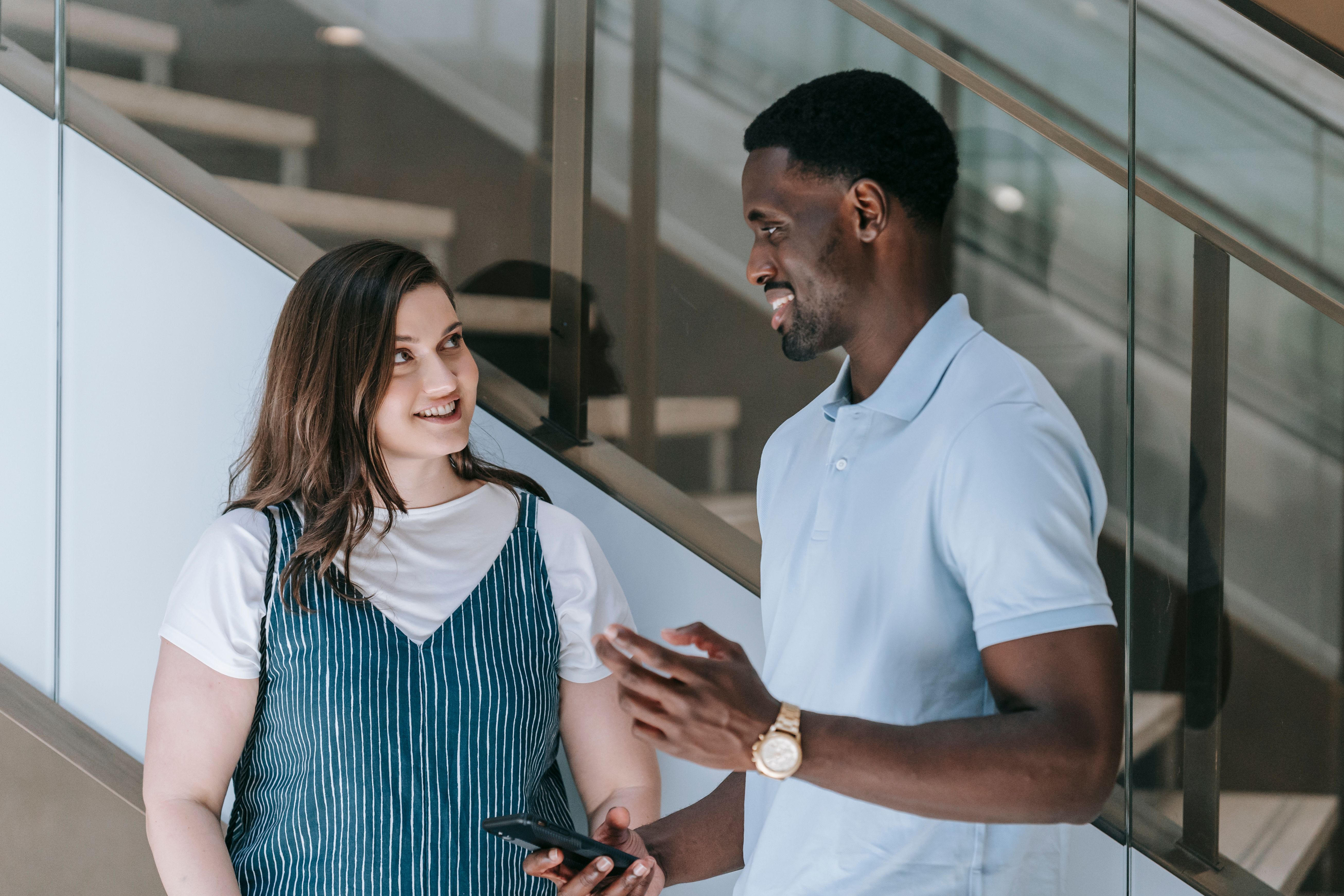 A man is talking to a woman.
