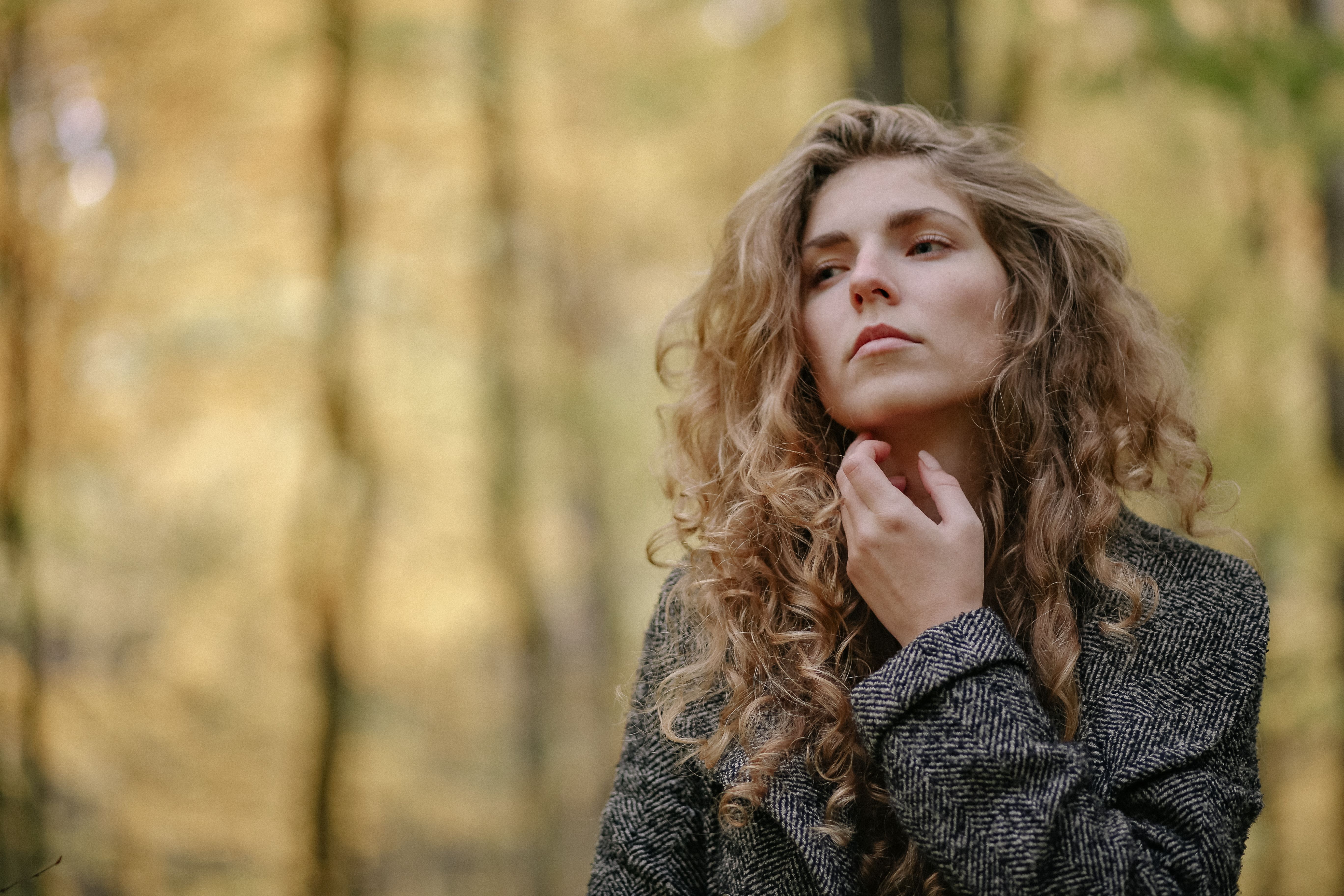 A woman is pondering something deeply.