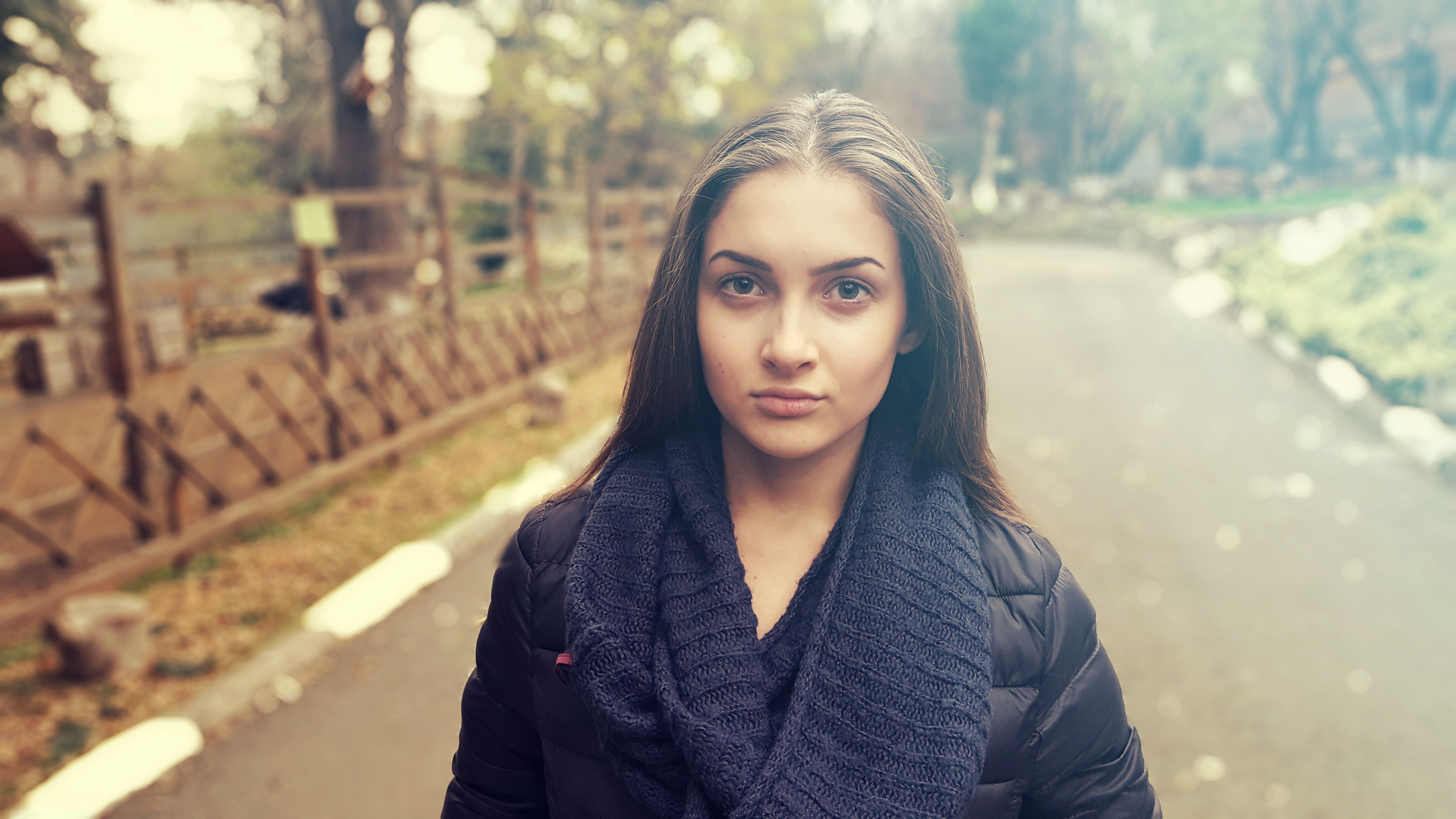 A woman looks annoyed on the street.