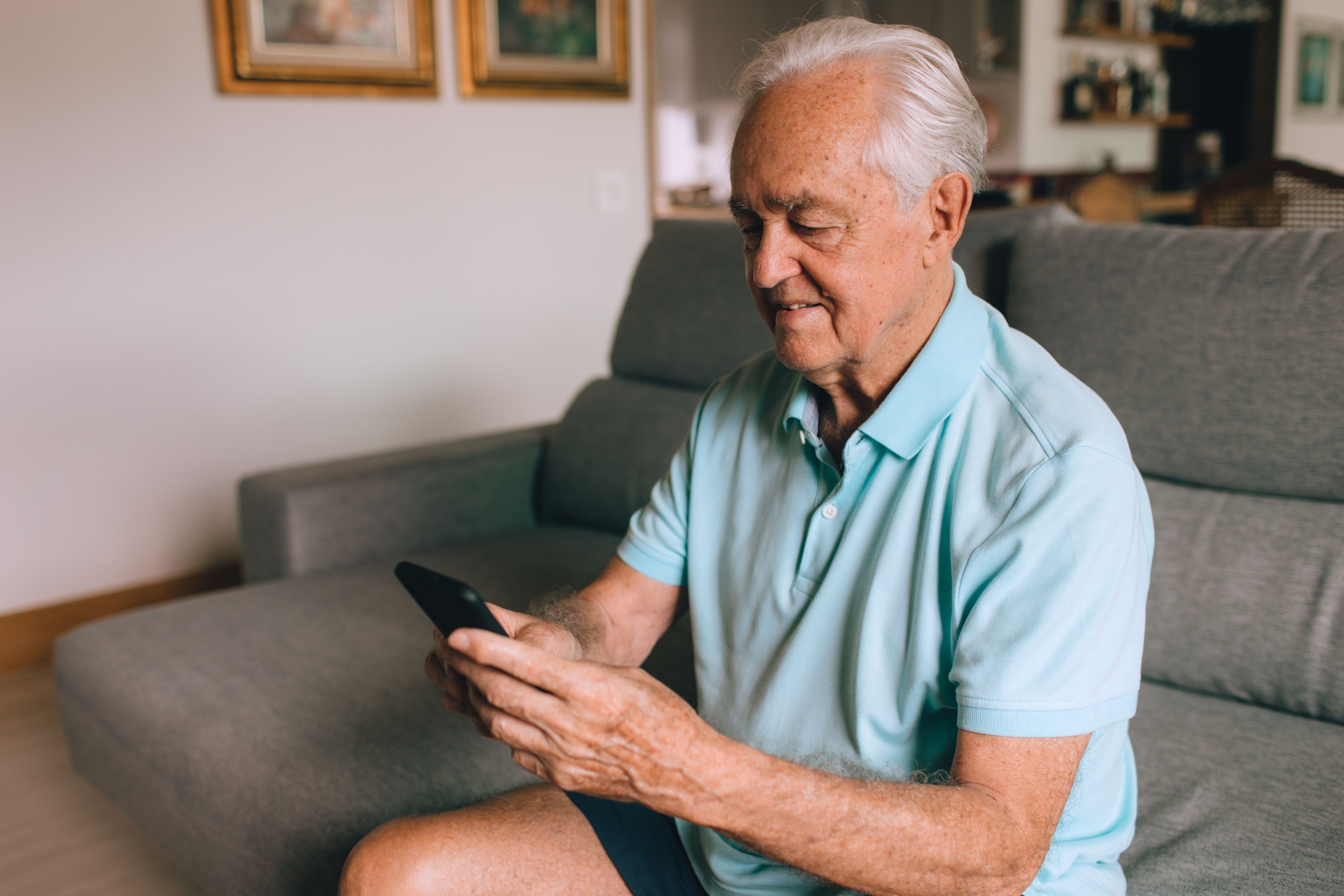 A man is looking up something on his phone.