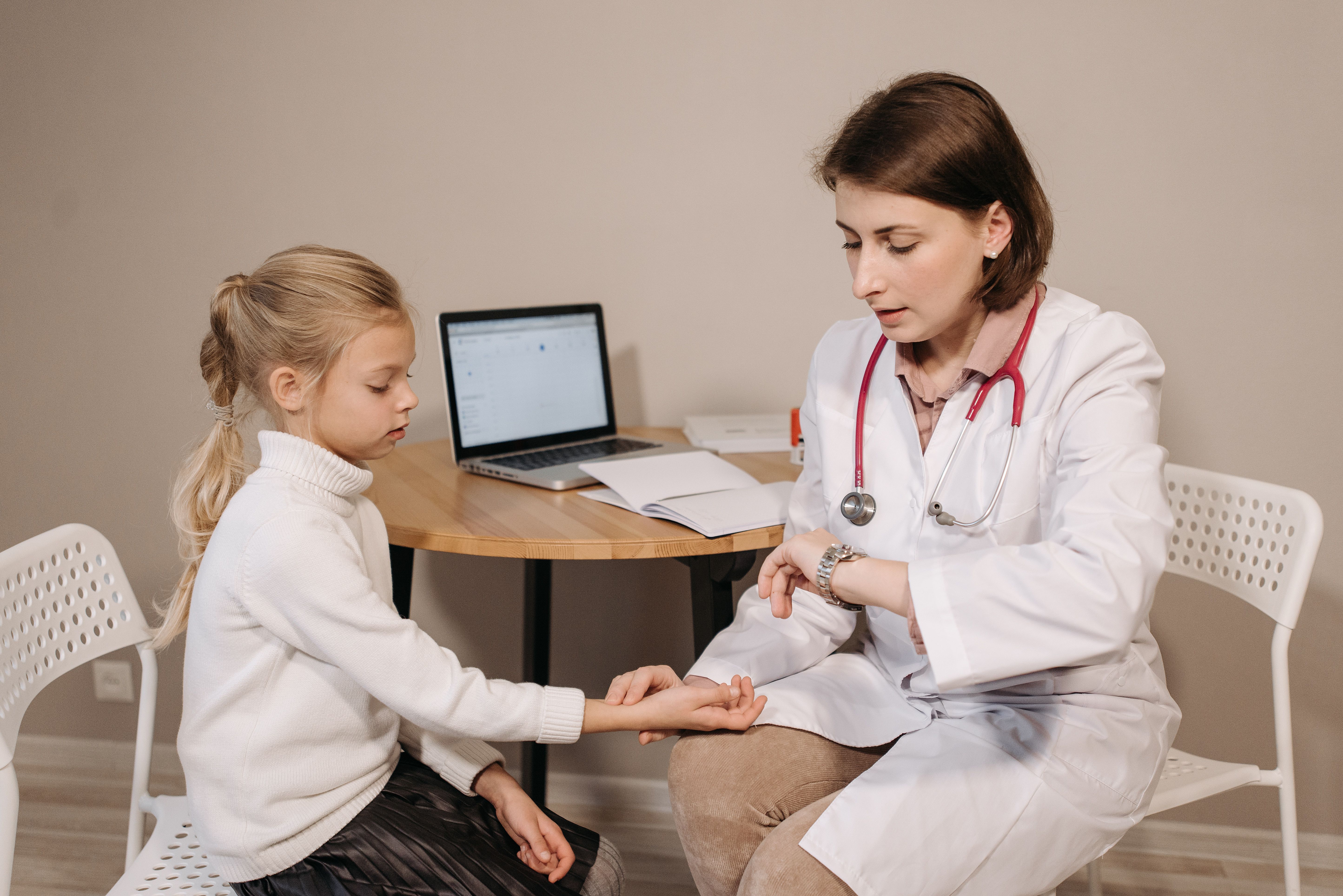 A young patient is being examined by a doctor.