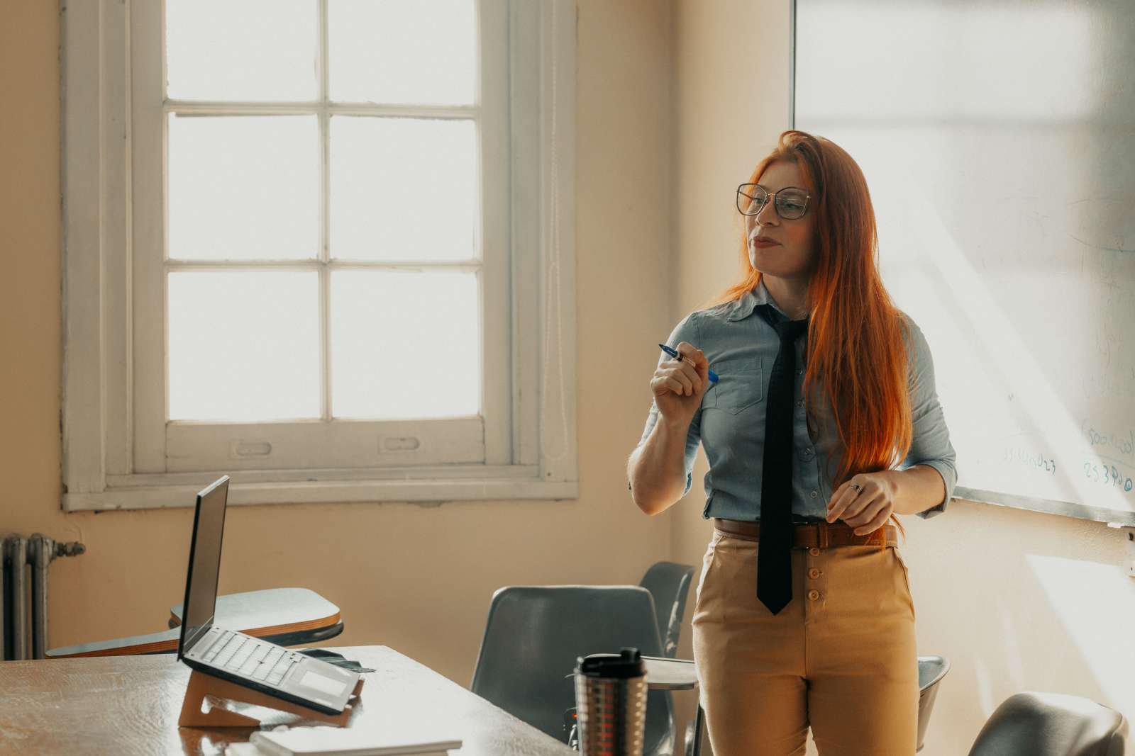 A strict teacher in a classroom.