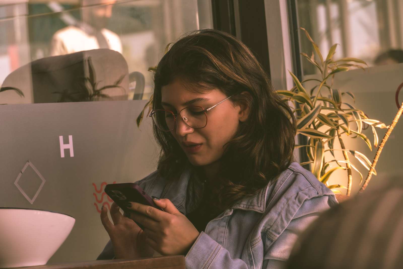 A woman is using her phone.