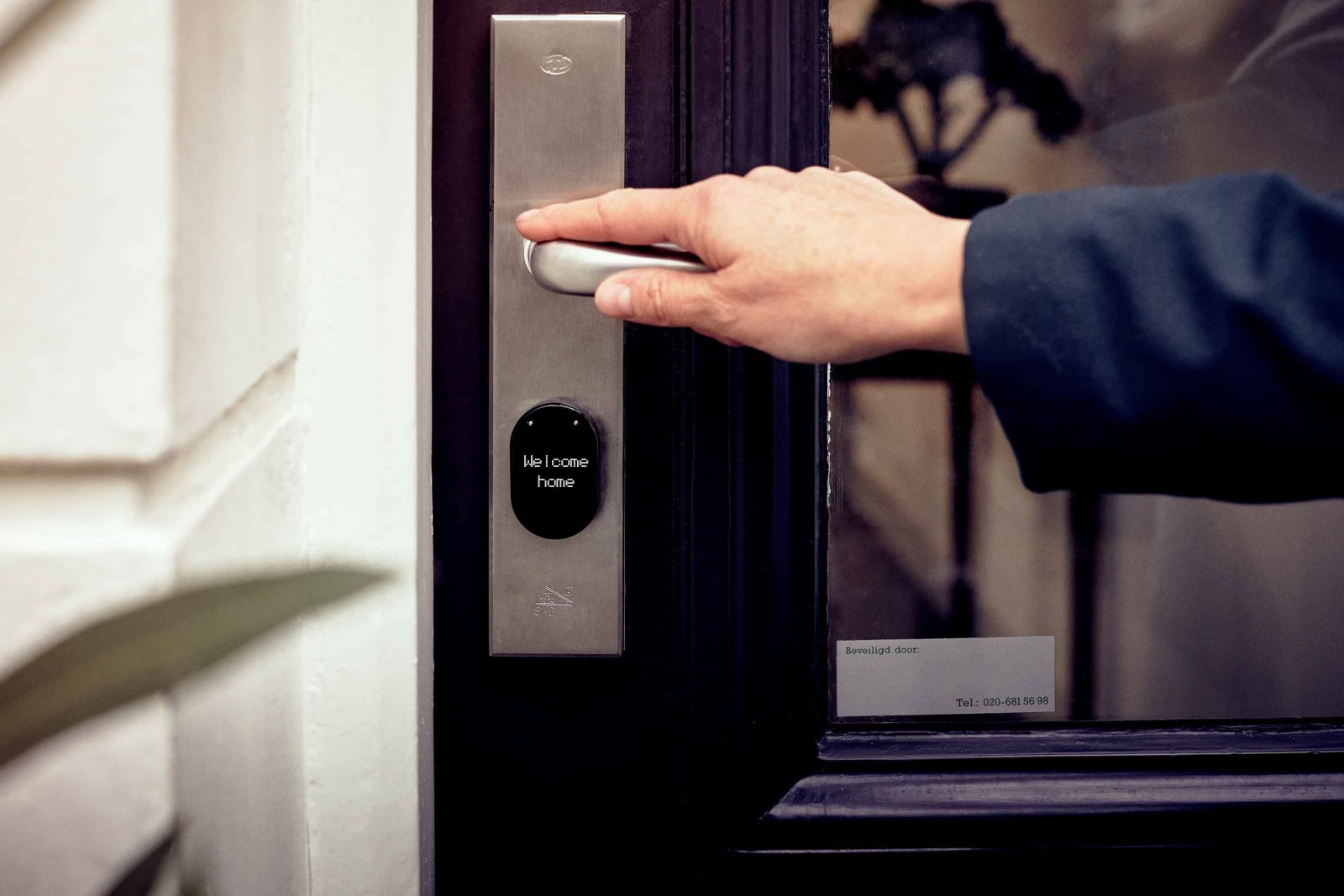 A man trying to enter into a home.