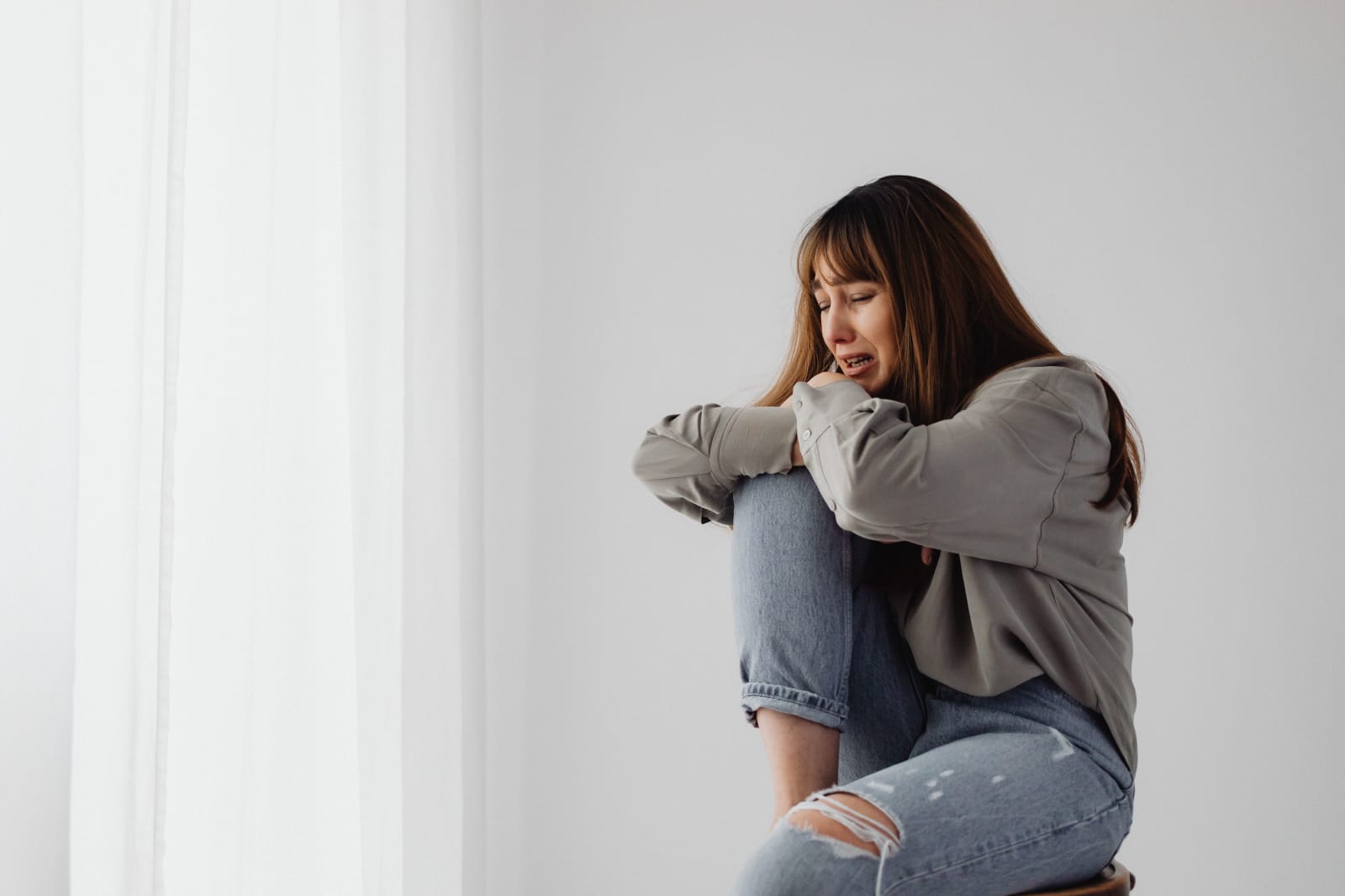 A woman crying and depressed.