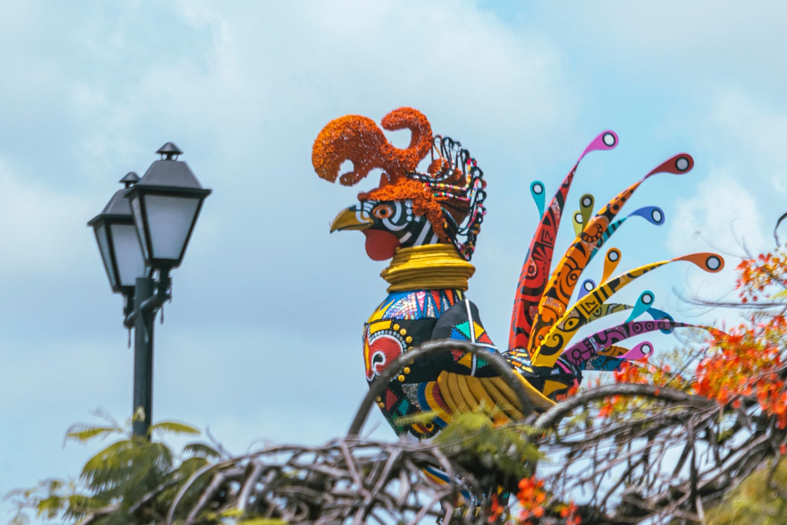 A rooster display in someone's yard.