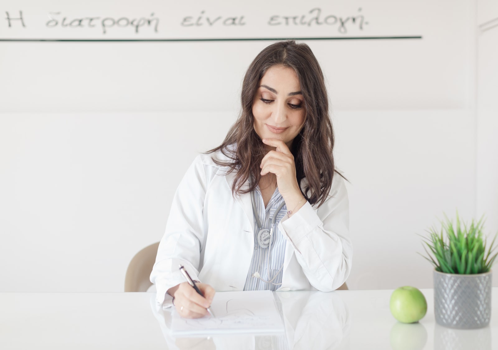 A doctor smiles in disbelief while working.
