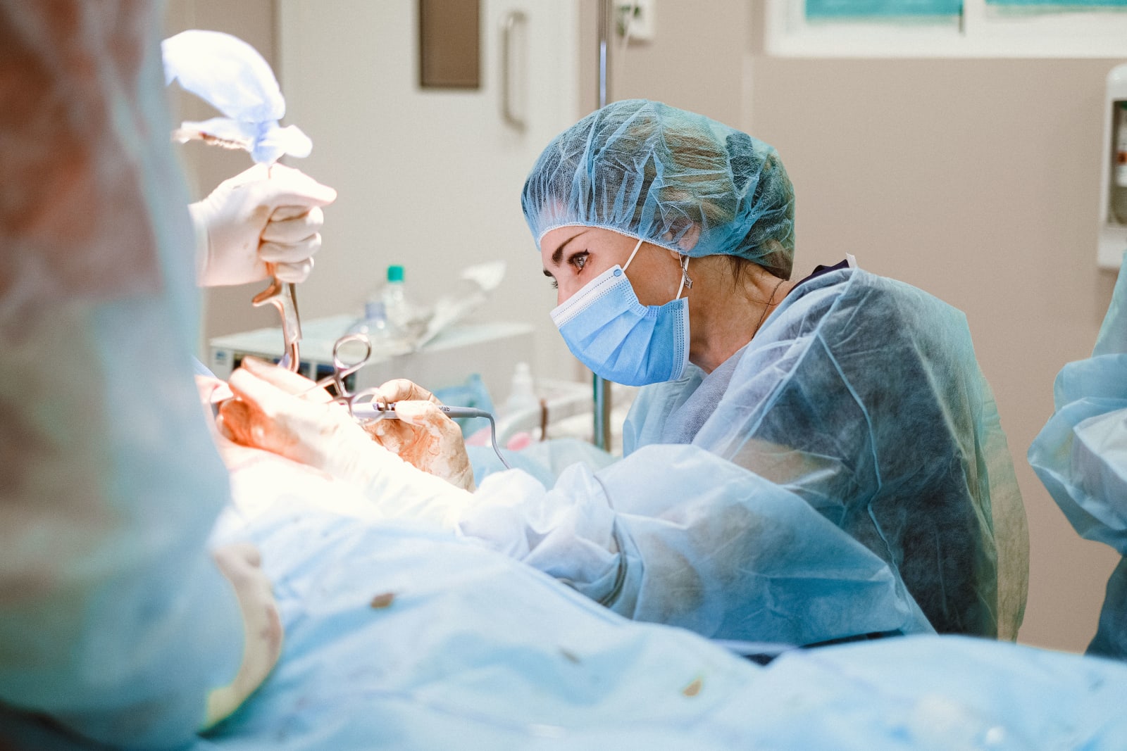 A surgeon focused on a procedure in a sterile operating room. (Representative Image Source: Pexels | Anna Shvets)