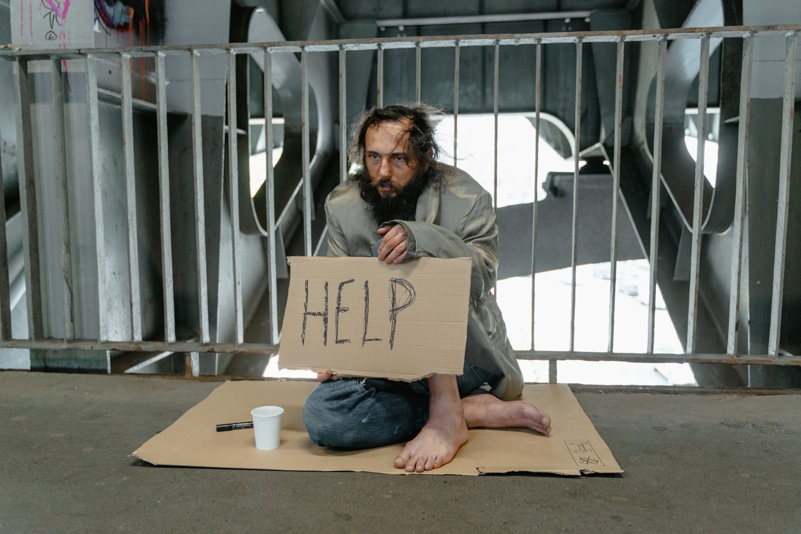 A homeless person is begging.