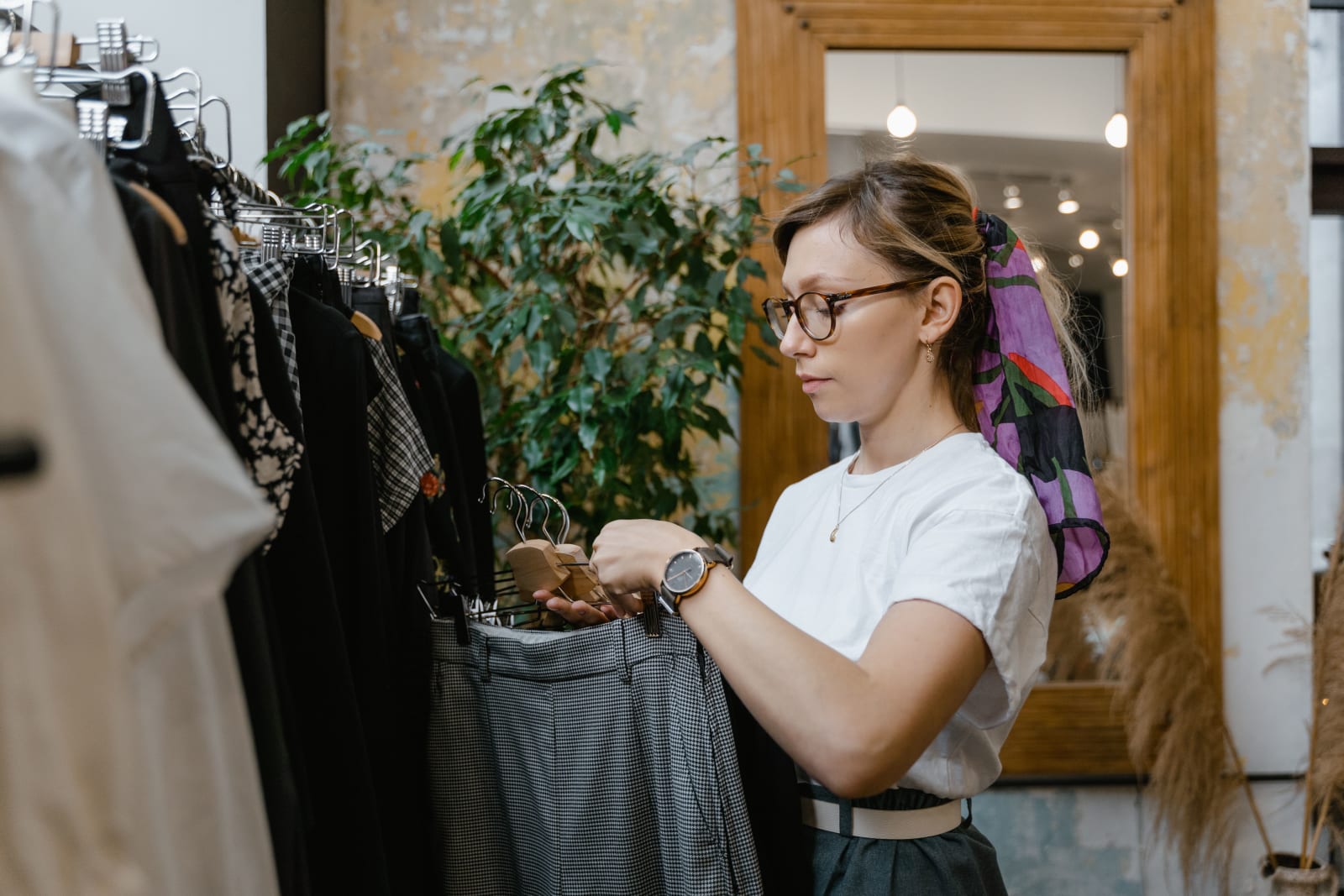 A woman is thrift shopping.