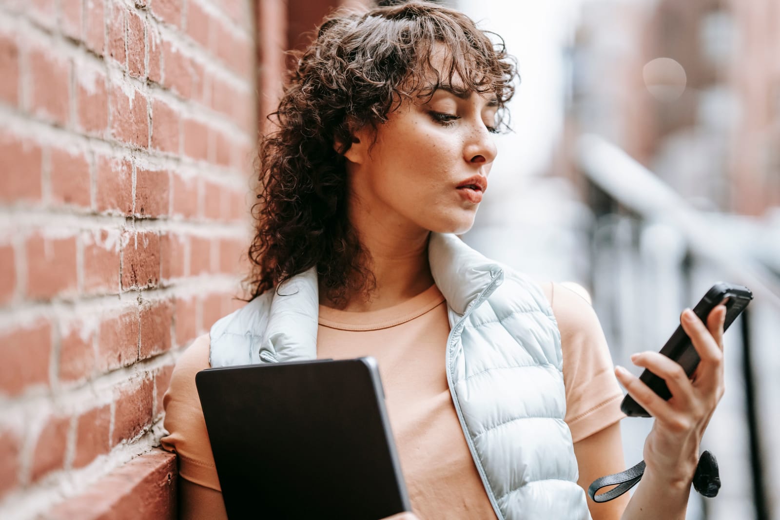 A woman looks at her phone.