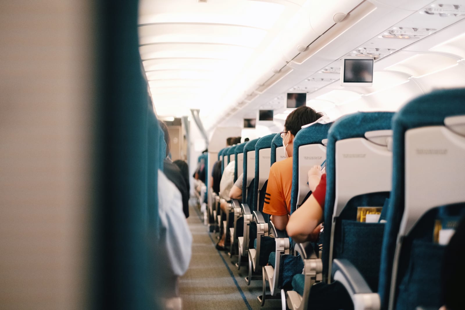 Interior view of airplane cabin showing passengers seated during a flight. (Representative Image Source: Pexels | Pew Nguyen)