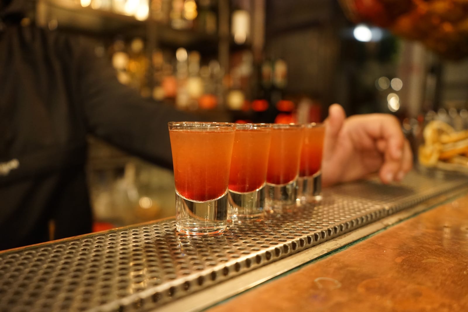 Colorful cocktail shots ready on a bar counter. (Representative Image Source: Pexels | Denisa Susca)