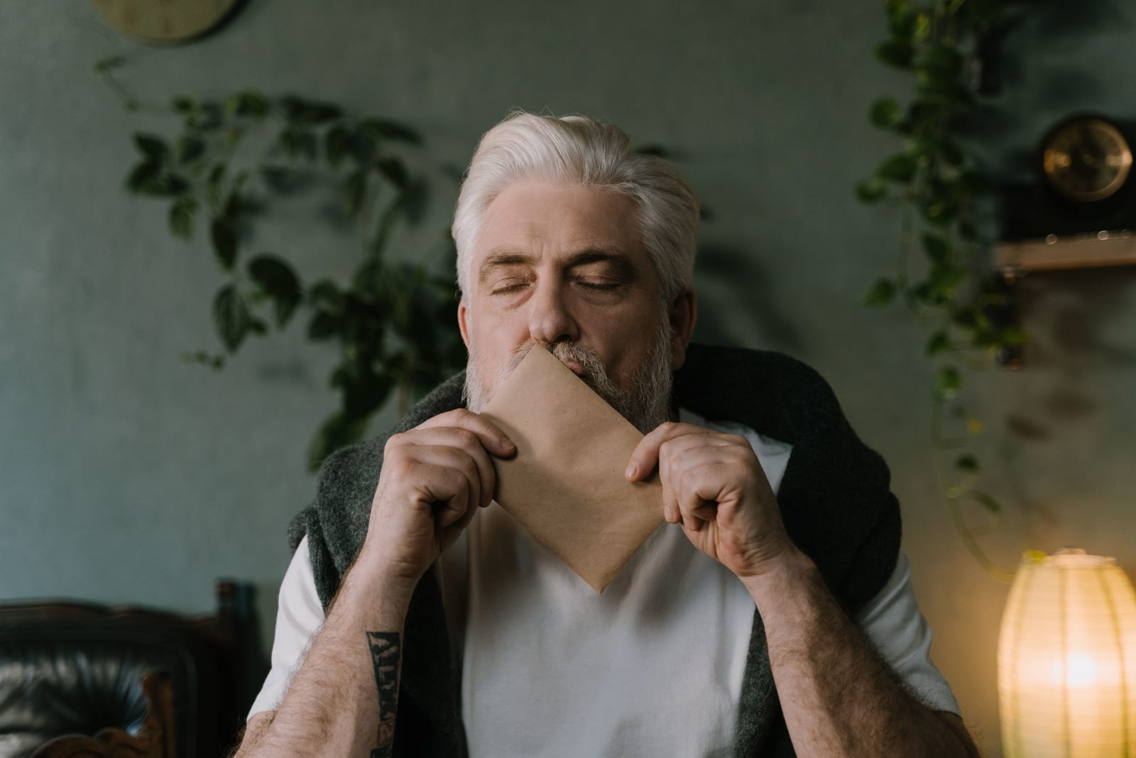 Man licking envelope (Representative Image Source: Pexels | cottonbro studio)