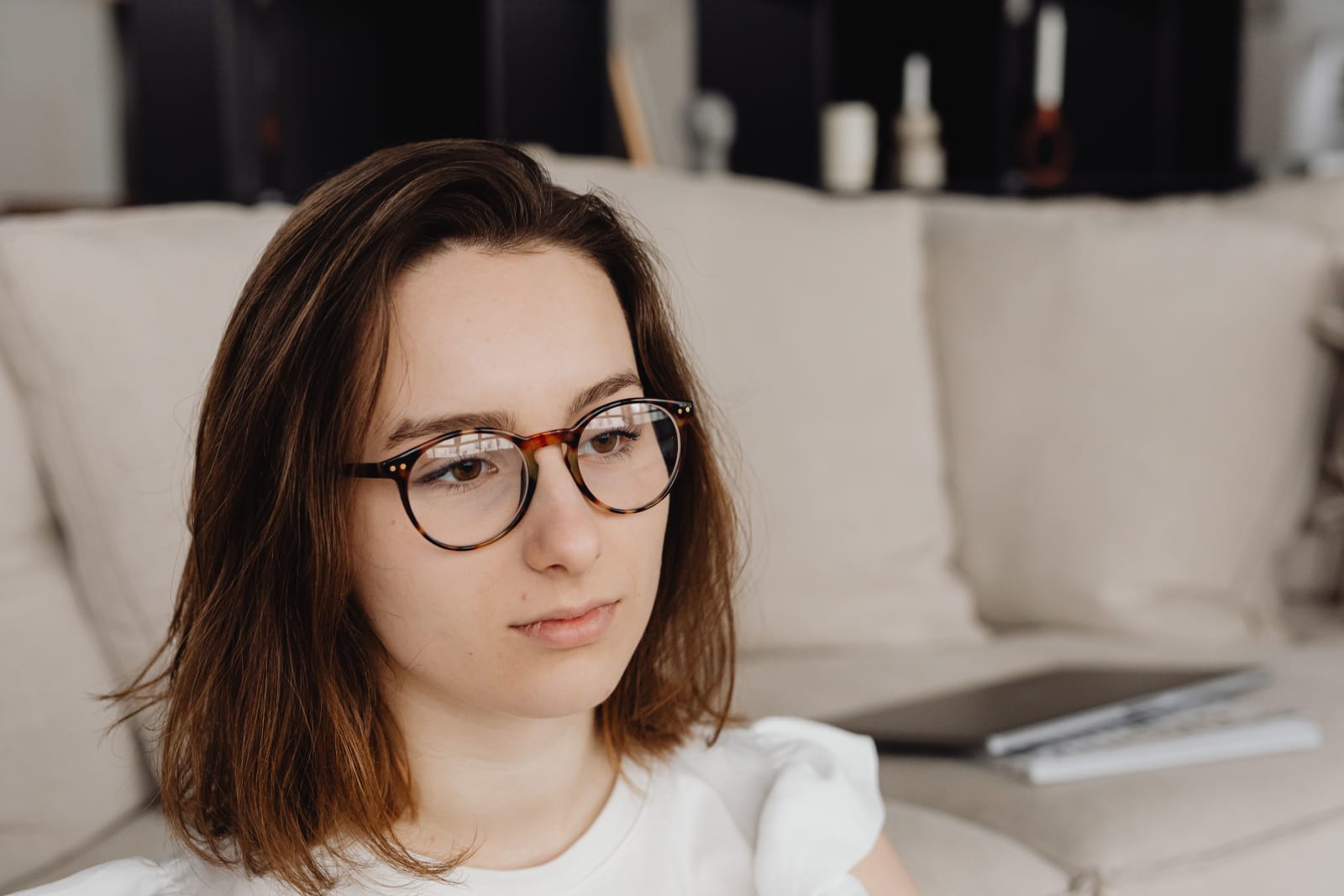A woman is pondering something deeply.