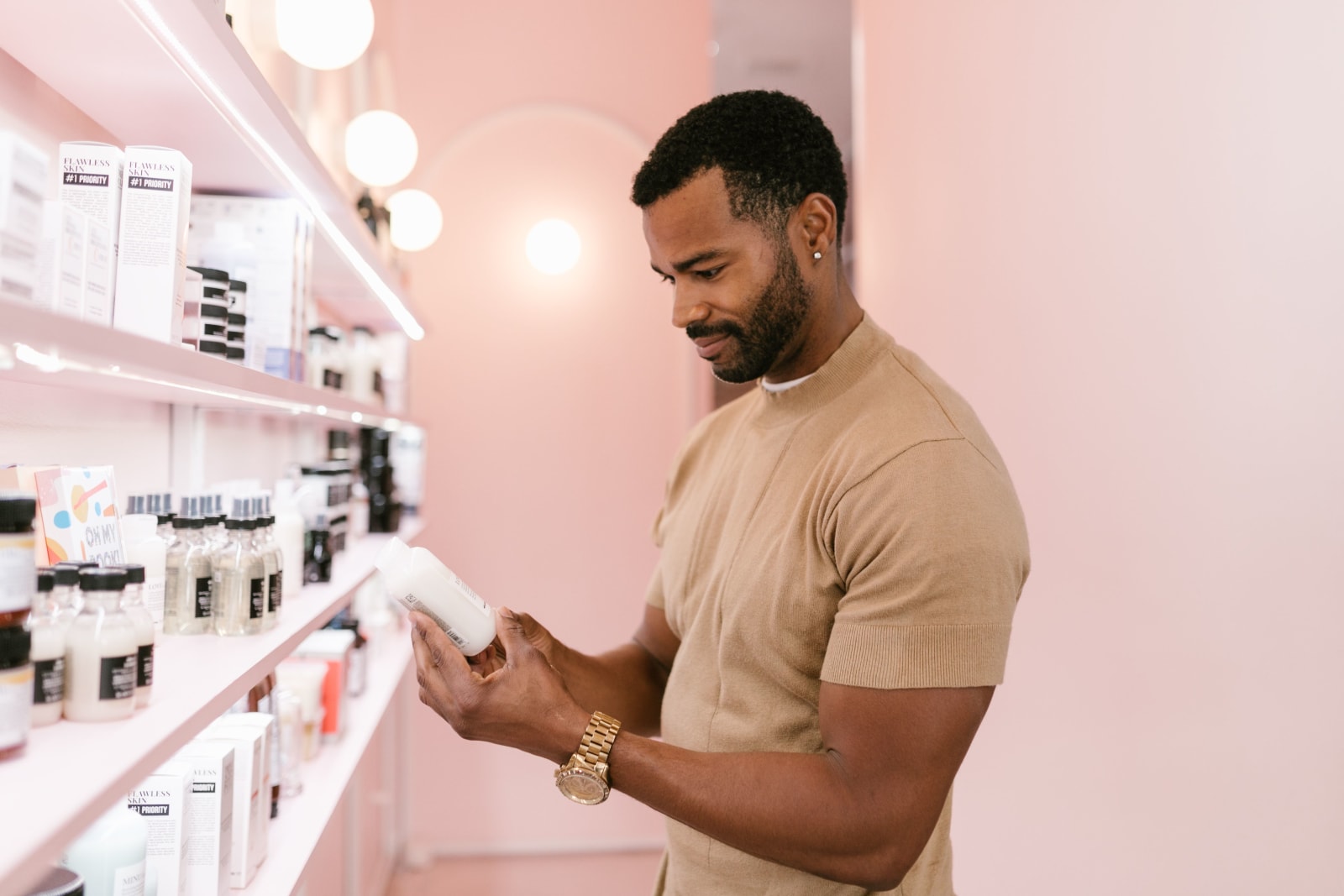 A worker picking products before skincare service.