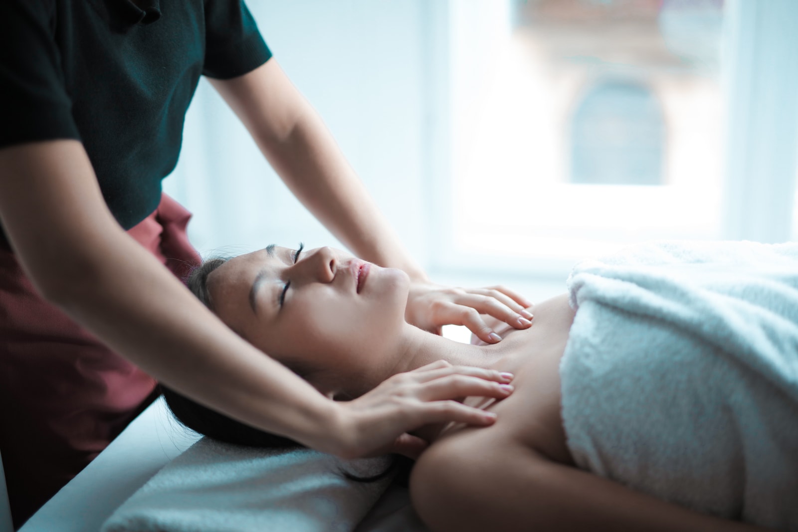 A woman receiving a professional massage.