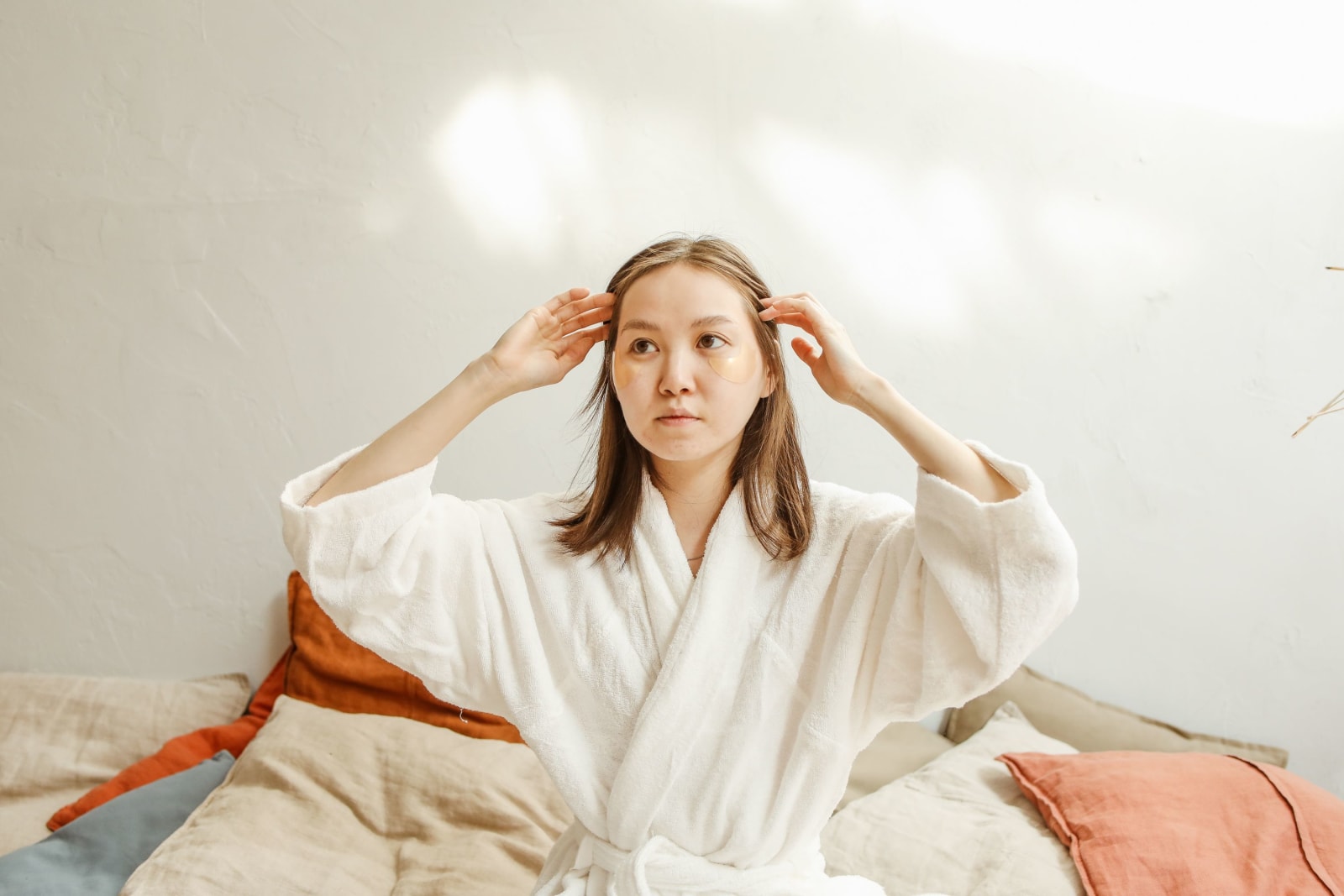 A woman in a robe looks disappointed.